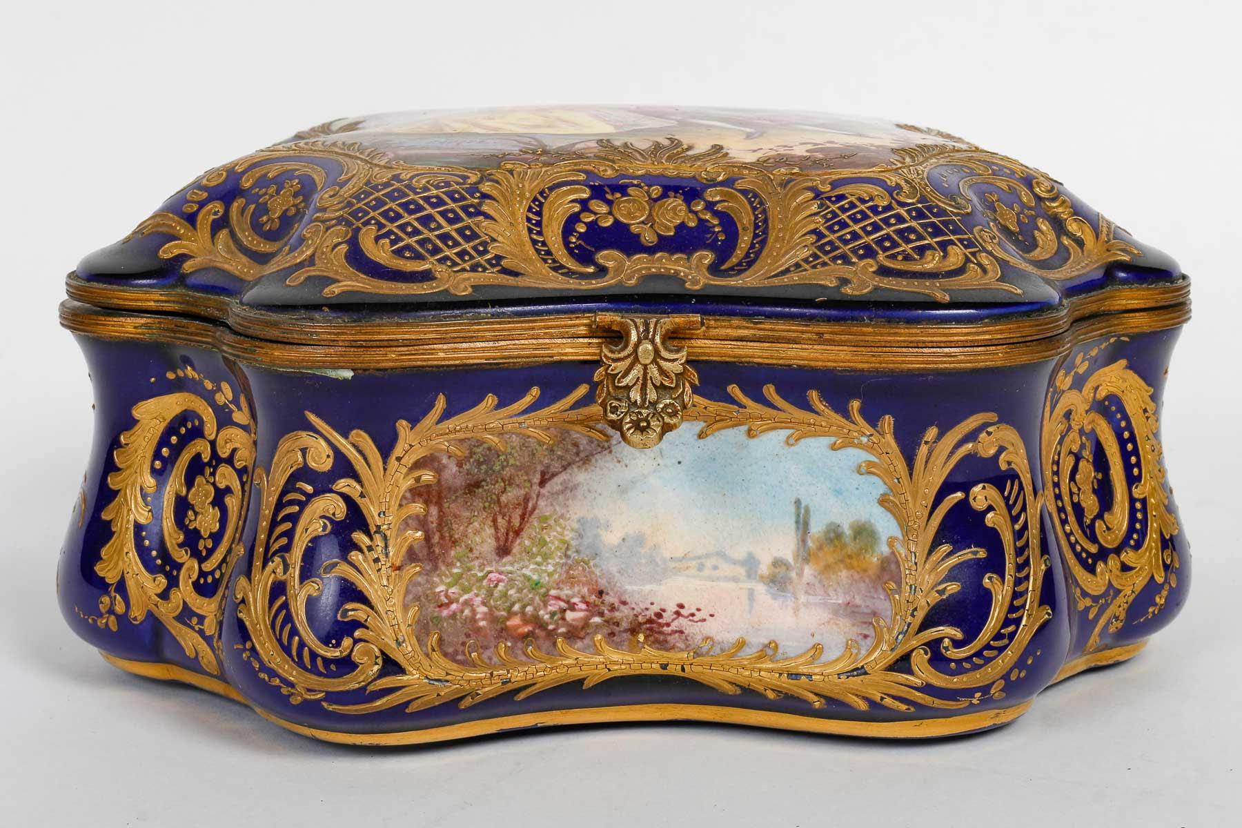 Sèvres porcelain box and chest, 19th century.

A Sèvres porcelain box, richly decorated with 3 paintings on the belt and one on the top, enhanced with gold, Napoleon III period, 19th century.

H: 11cm, W: 22cm, D: 17.5cm