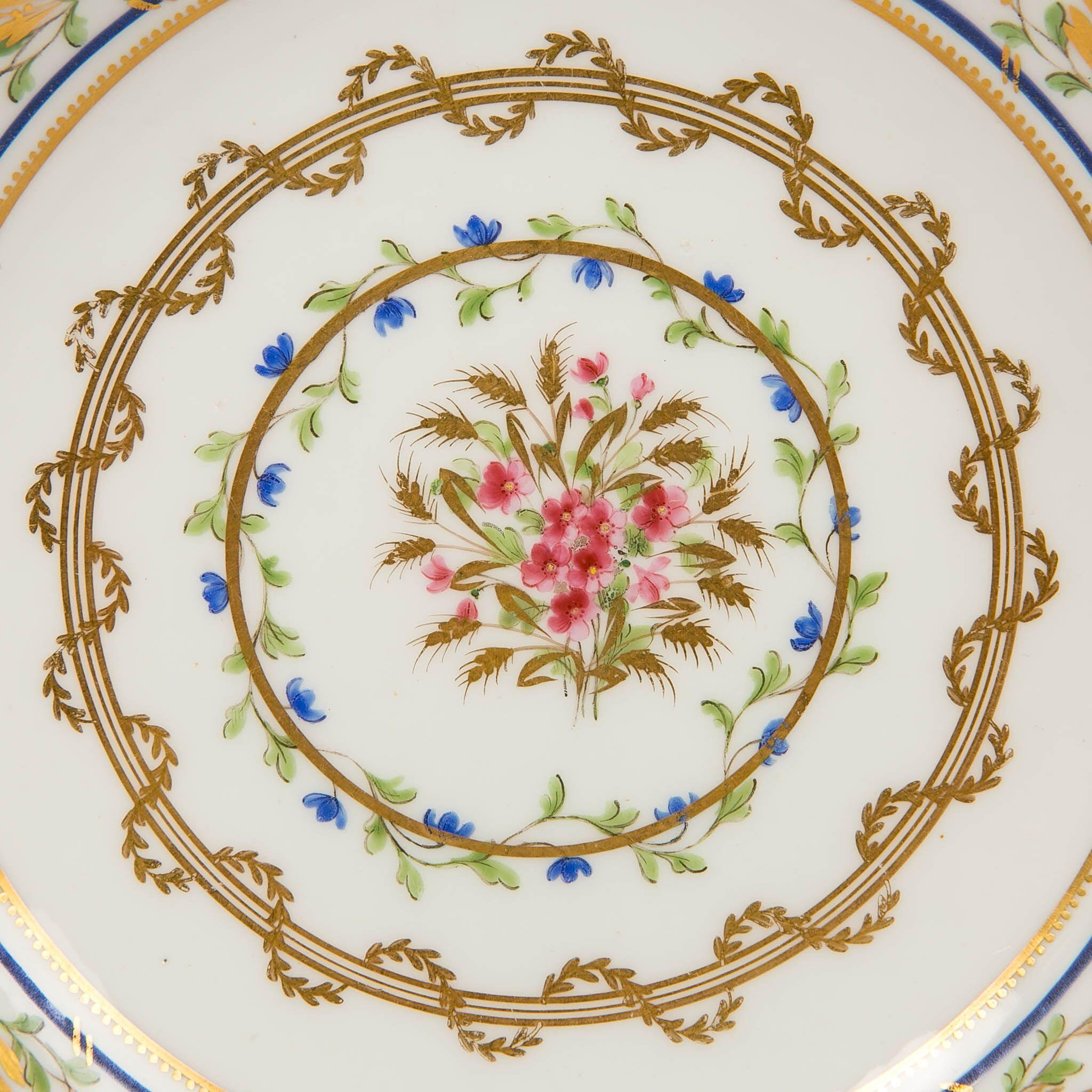 We are pleased to offer this beautiful, hand-painted Sèvres porcelain dish which typifies the exquisite French style of the eighteenth century. The colors and design create a sense of movement, intensity and life. The center is decorated with a