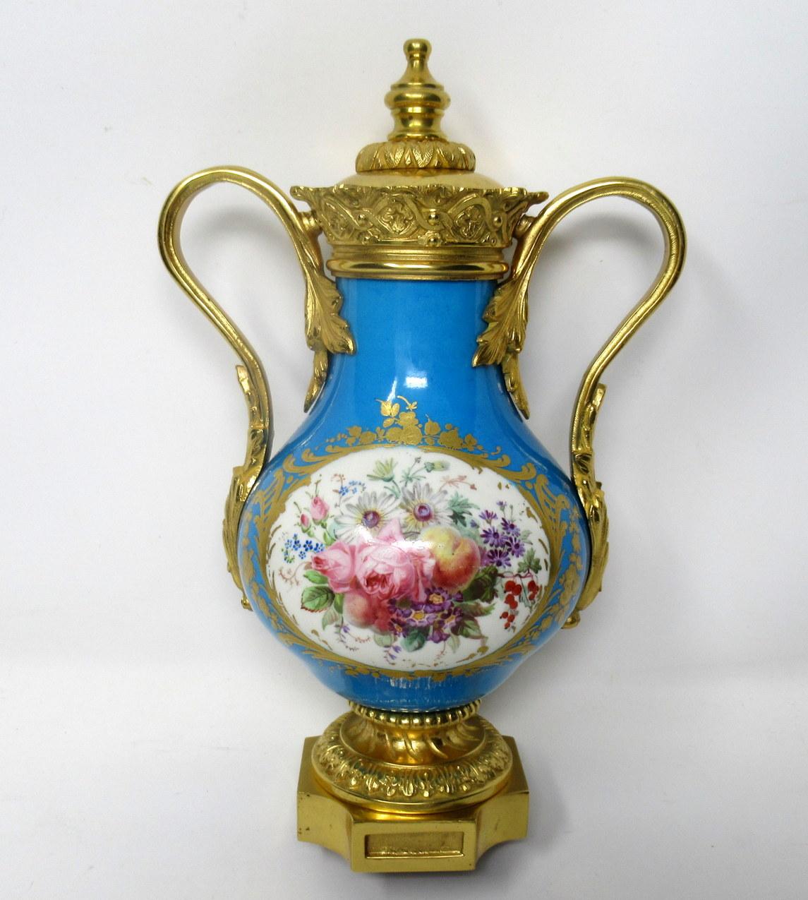 Stunning French Sevres soft paste porcelain and Ormolu twin handle table or mantle urn of traditional bulbous form and of outstanding quality, raised on a square stepped base with canted corners. 

The twin handles exquisitely modelled as