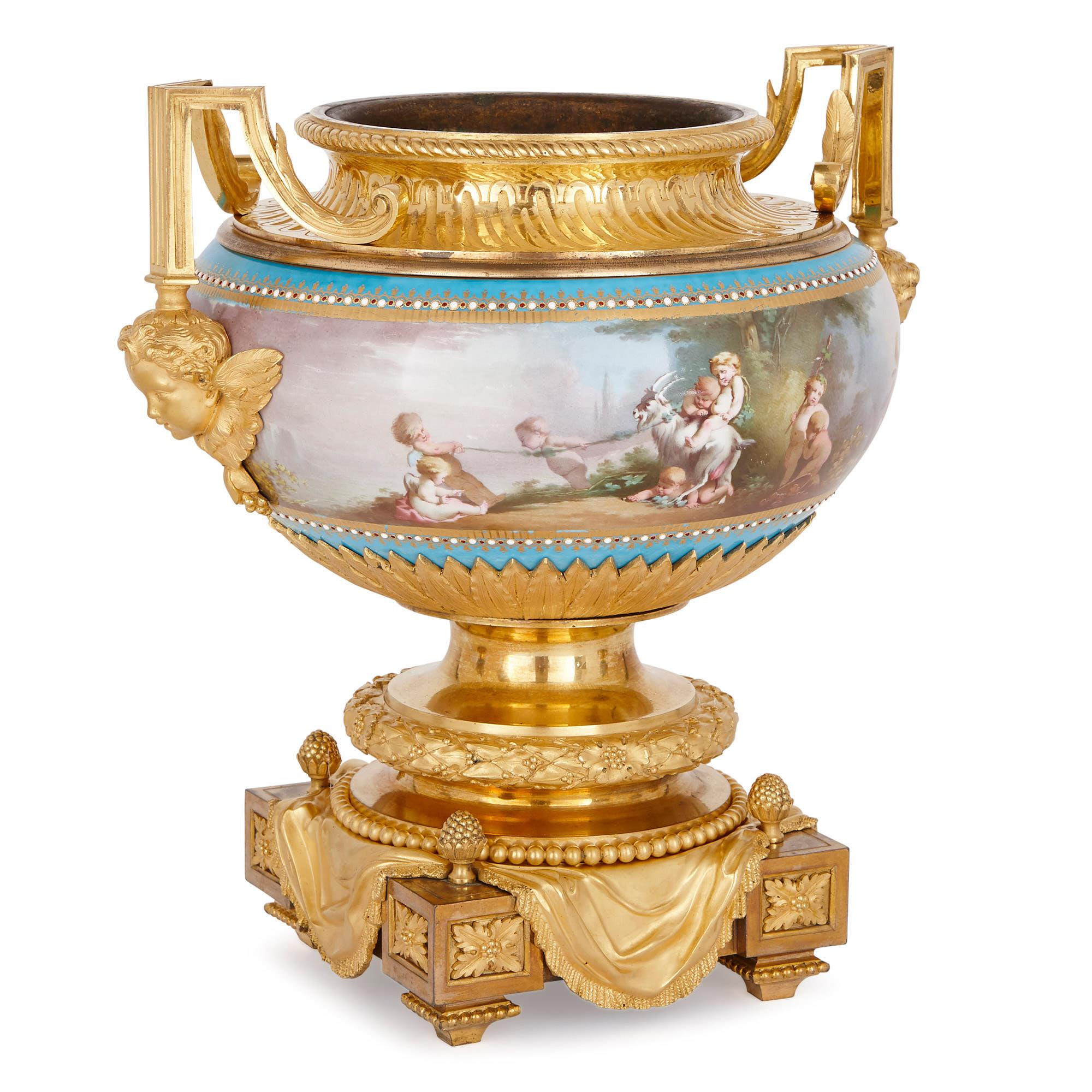 With its delightful painted representations of the four seasons and bacchanalian scenes, this ‘bleu celeste’ garniture demonstrates the technical excellence of Sevres factory porcelain. On top of this, the porcelain vases are beautifully decorated