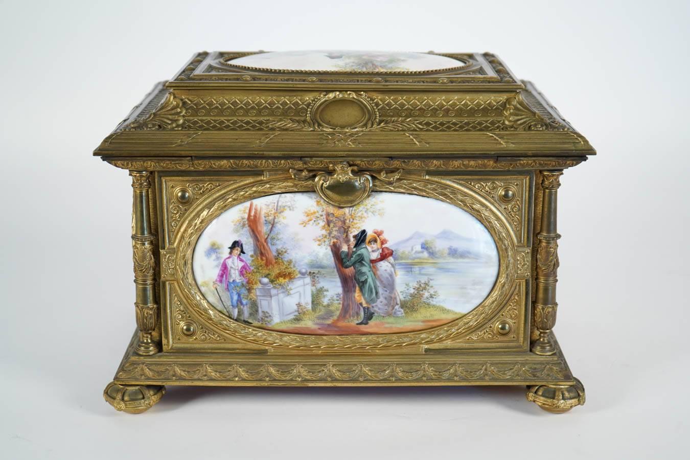 19th century large jewelry porcelain box with gilt bronze mounts.
This box features five hand painted porcelain plaques with stunning gilt bronze framework
each porcelain plaque is representing different scenes.