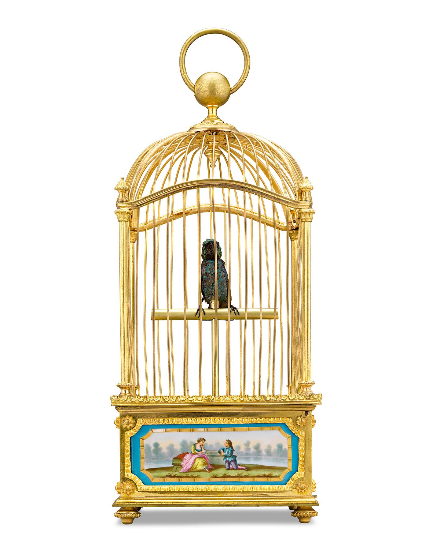 A mechanical bird sings in its gilded cage in this exceptionally rare French automaton. Combining outstanding artistry with mechanical genius, the gilt brass cage is mounted with hand painted Sèvres porcelain panels. A singing bird mechanism is