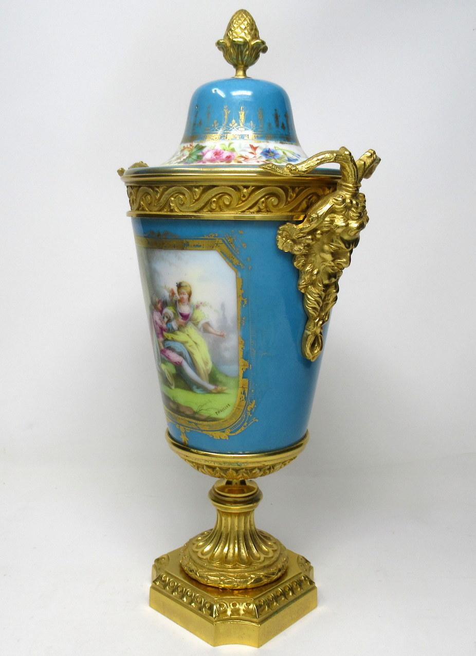 Stunning French Sevres soft paste porcelain and ormolu twin handle table or mantle urn of traditional form and of outstanding quality, and good size proportions, raised on a square stepped base with canted corners. 

The twin handles exquisitely