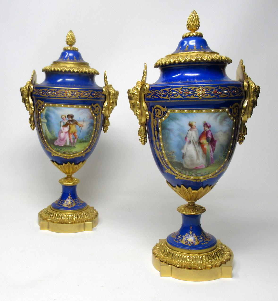 Stunning pair of French Sevres soft paste porcelain and ormolu twin handle table or mantle urns of traditional form and of outstanding quality, and good size proportions, each raised on a square stepped base with canted corners. 

The twin handles
