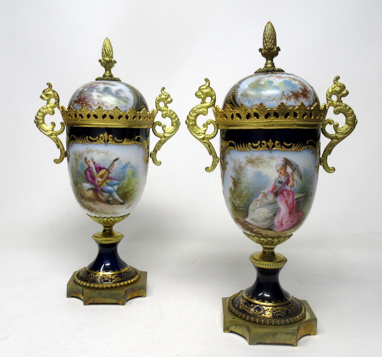 Stunning pair of French Sèvres style soft paste porcelain and ormolu twin handle table or mantel (fireplace) urns of traditional form, of outstanding quality, and medium size proportions, each raised on a square stepped base with beaded detailing
