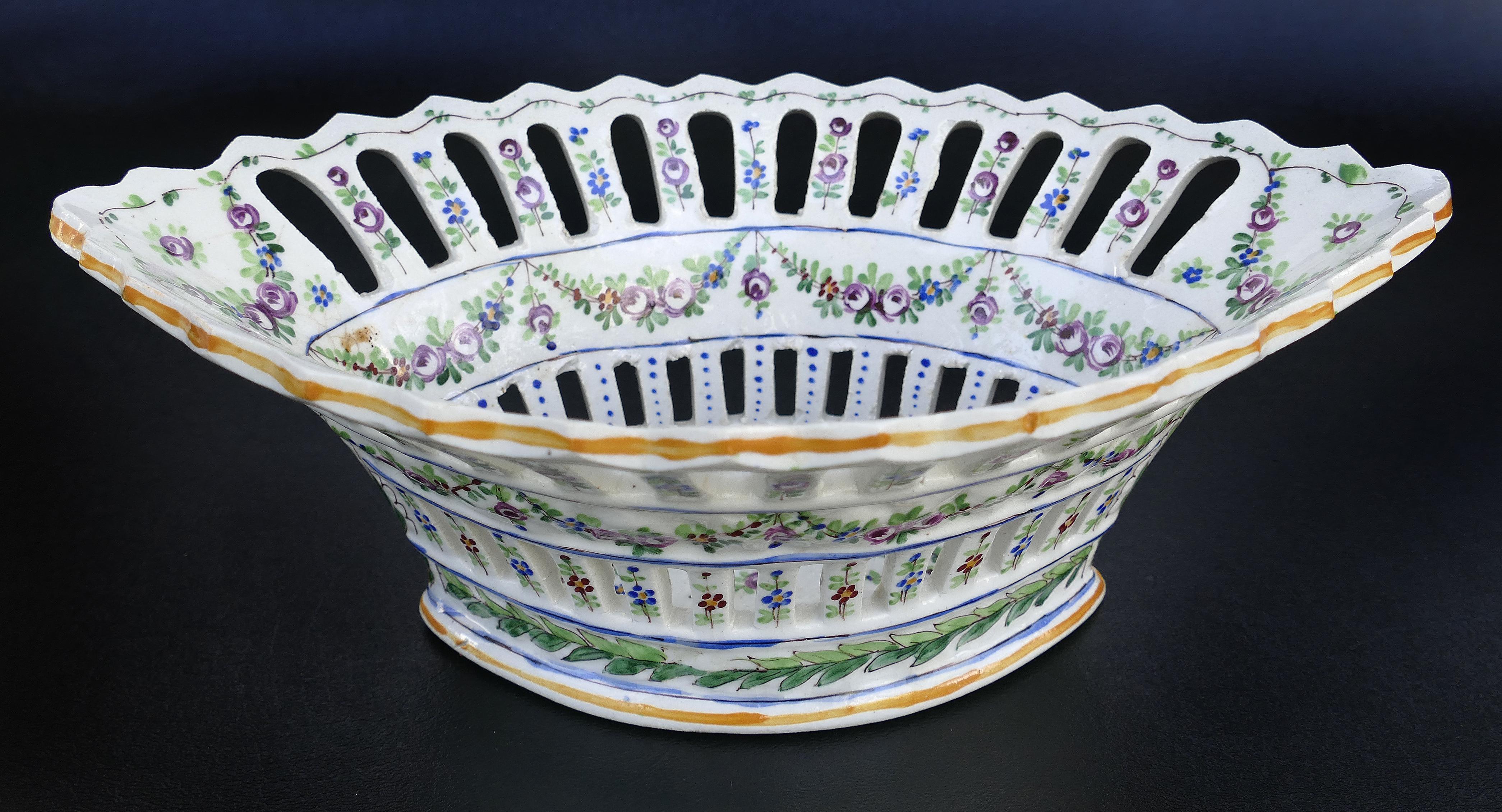 Sevres reticulated hand painted porcelain basket with scalloped edge

Offered for sale is a Sevres France hand painted porcelain reticulated bowl or basket with a scalloped edge and hand painted garlands swagged on the exterior. The piece is