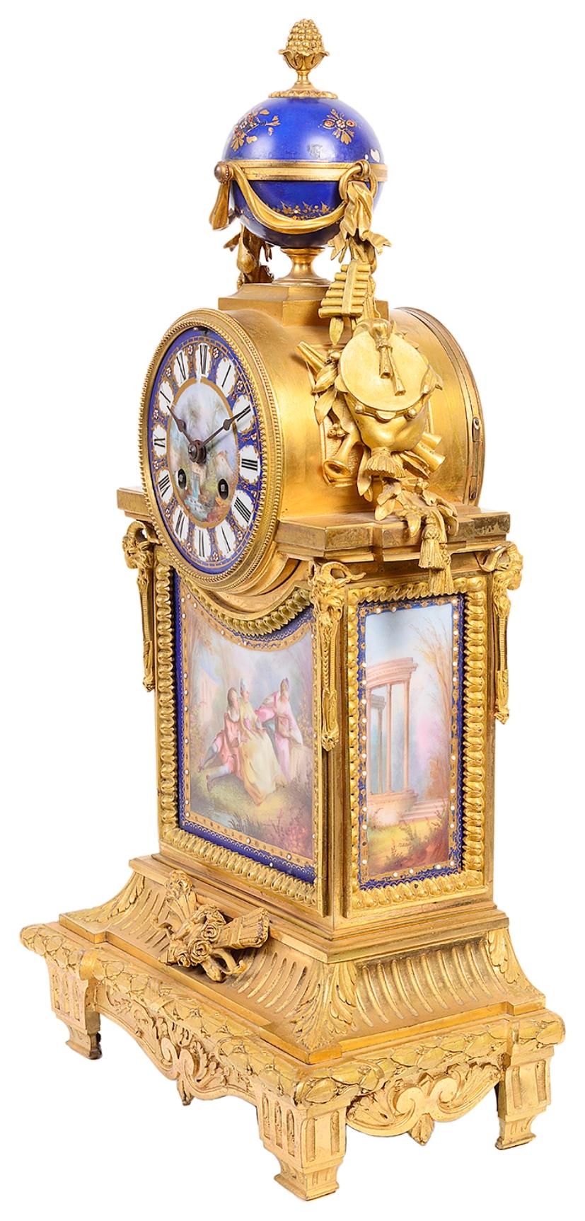 A good quality French 19th century gilded ormolu mantel clock with Sevres style porcelain plaques. Having a central porcelain globe with drapes and musical instruments hanging down either side of the eight day duration chiming clock, which has a