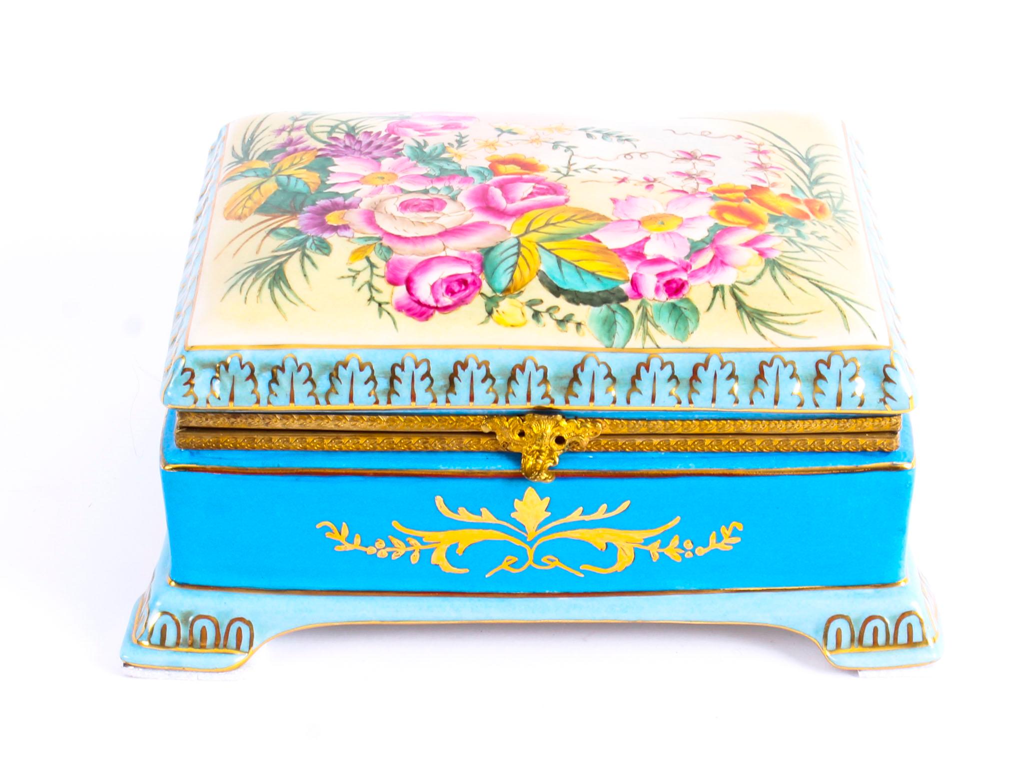This is a wonderful porcelain jewellery casket in the Sevres Style, dating from the last quarter of the 20th century.
 
This beautiful casket is rectangular in shape and is beautifully hand-painted in a celeste light blue. The hinged lid is