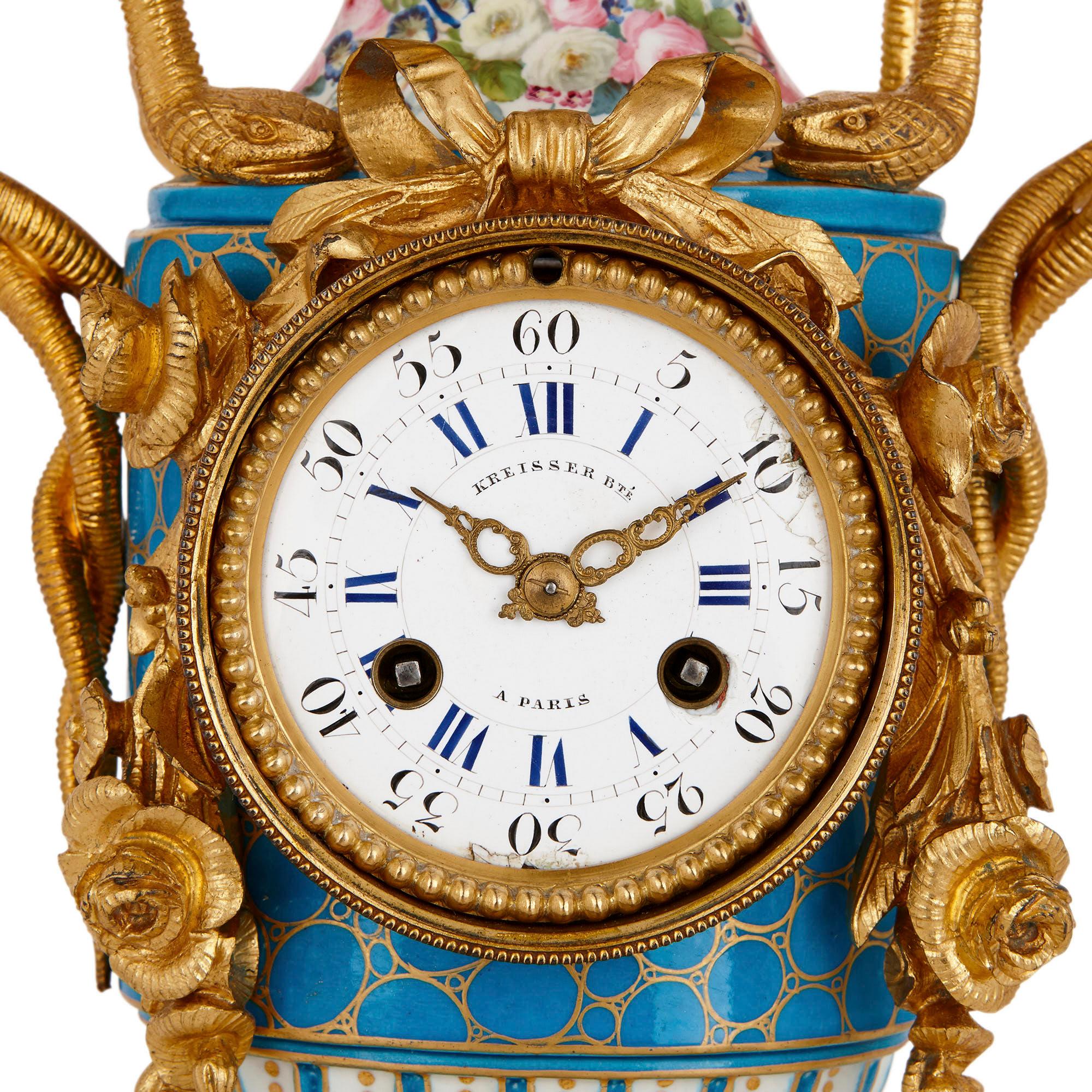 This gilt bronze mounted mantel clock is formed about a beautiful sky-blue, parcel gilt Sèvres style porcelain vase. The enamel dial is mounted within a gilt bronze drum that is draped with gilt bronze garlands and bows. The dial is enumerated with