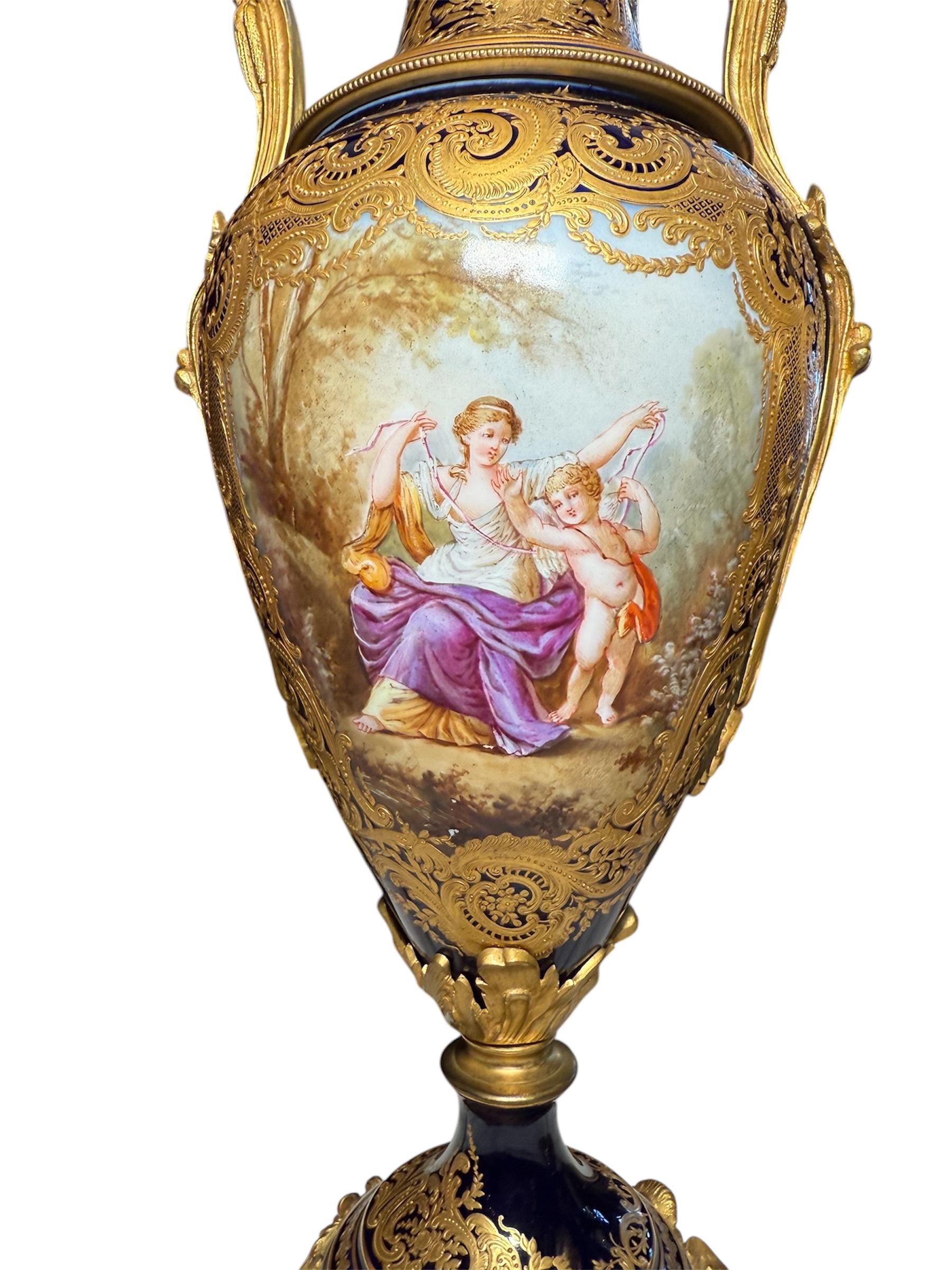 Renaissance Sevres Style Pair Of Gilt Cobalt Blue Urns For Sale