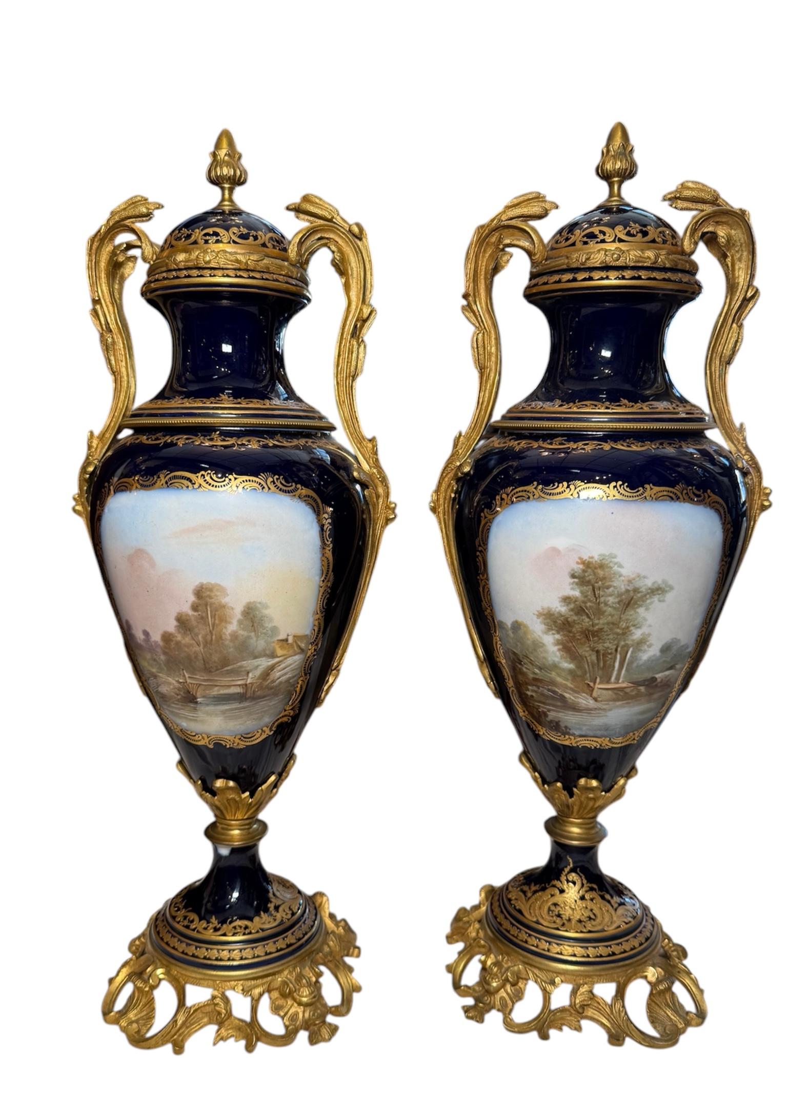 Porcelain Sevres Style Pair Of Gilt Cobalt Blue Urns For Sale