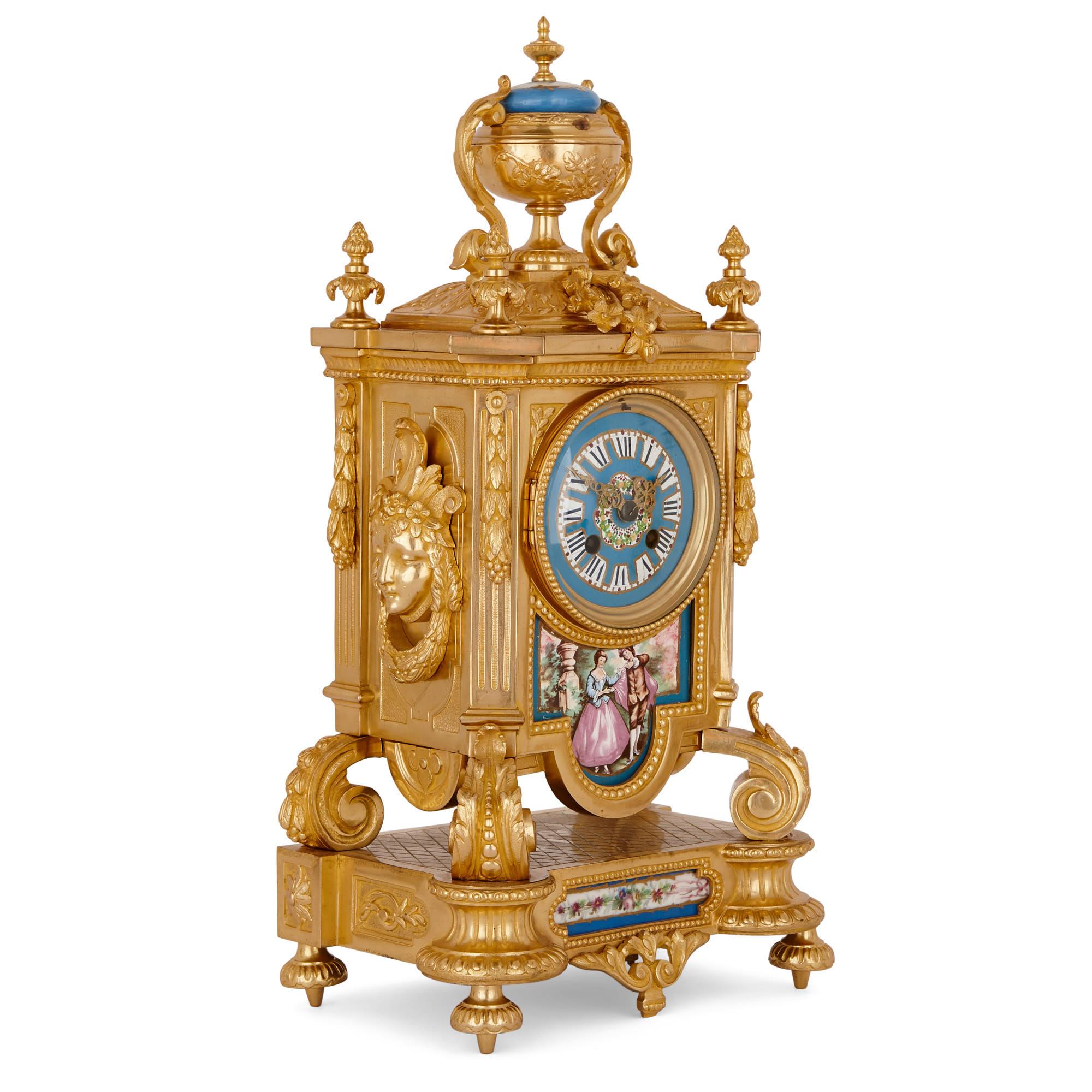 This exquisite clock set is designed in an elegant 18th-Century Rococo manner, in the style of Sèvres porcelain wares. Rococo is characterised by its use of pastel colours, graceful natural forms and courtly elegance. 

The mantel clock case is