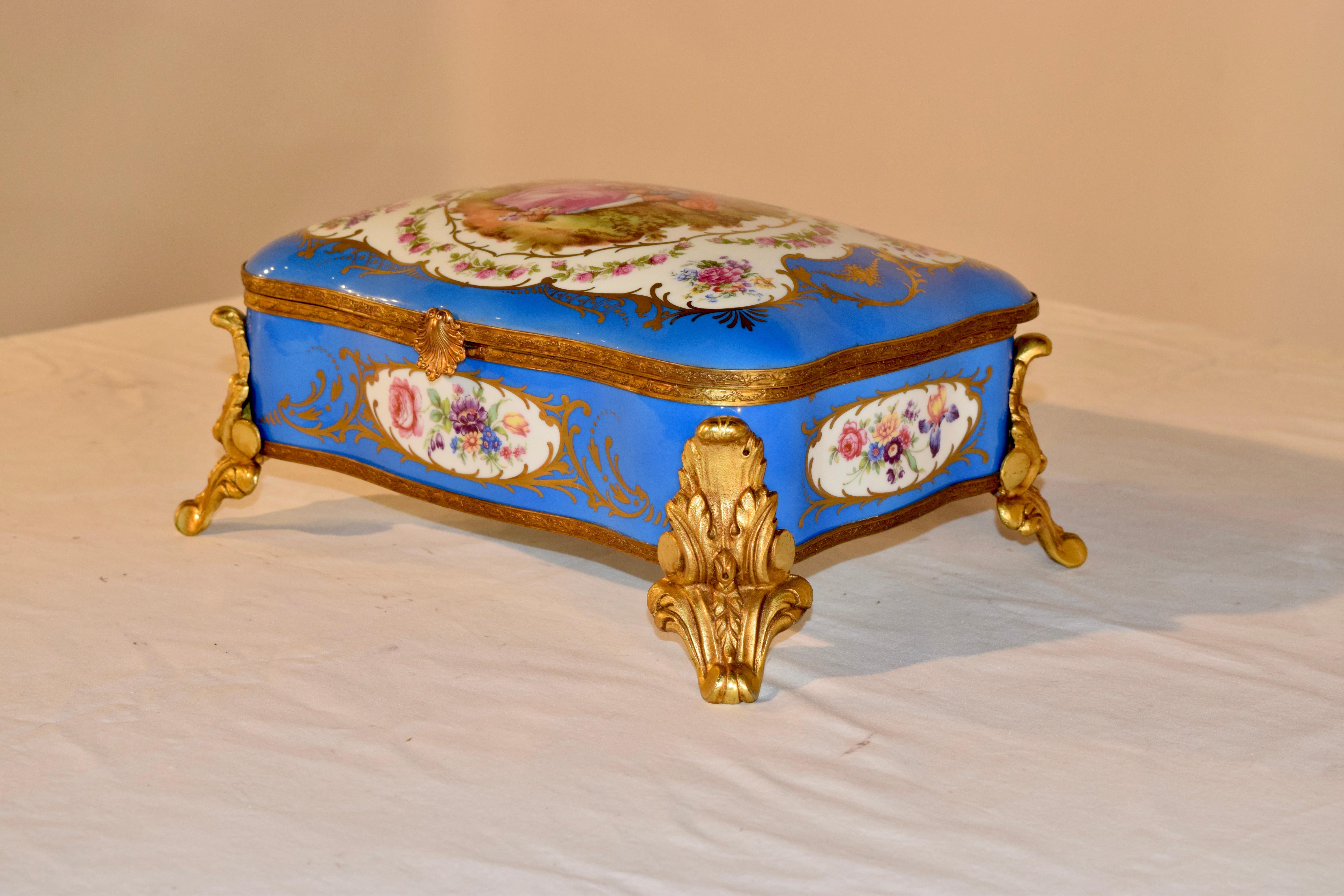 Sevres style hand painted porcelain dresser box with hand applied ormolu mounts and feet. Wonderful condition.