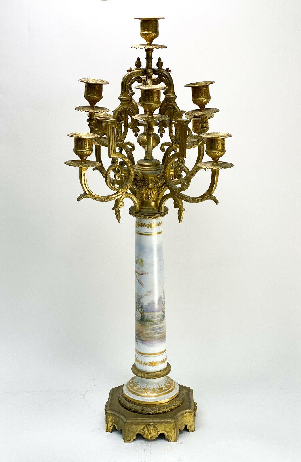 Sevres Style Porcelain & Gilt Bronze 10 Arm candelabra, circa 1900. Cherubs

The stem of the candelabra depicts a hand painted cherub chasing a bird Artist signed. Foliate scroll arms to the lights.

Additional information:
Department: Adults