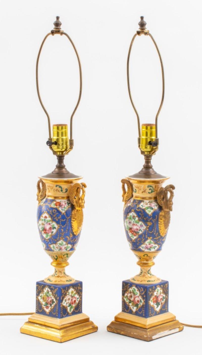 Pair of Sevres French Empire style porcelain ceramic vases mounted as lamps, the blue glazed urns with hand-painted gilt details and swan-form handles. 26.5