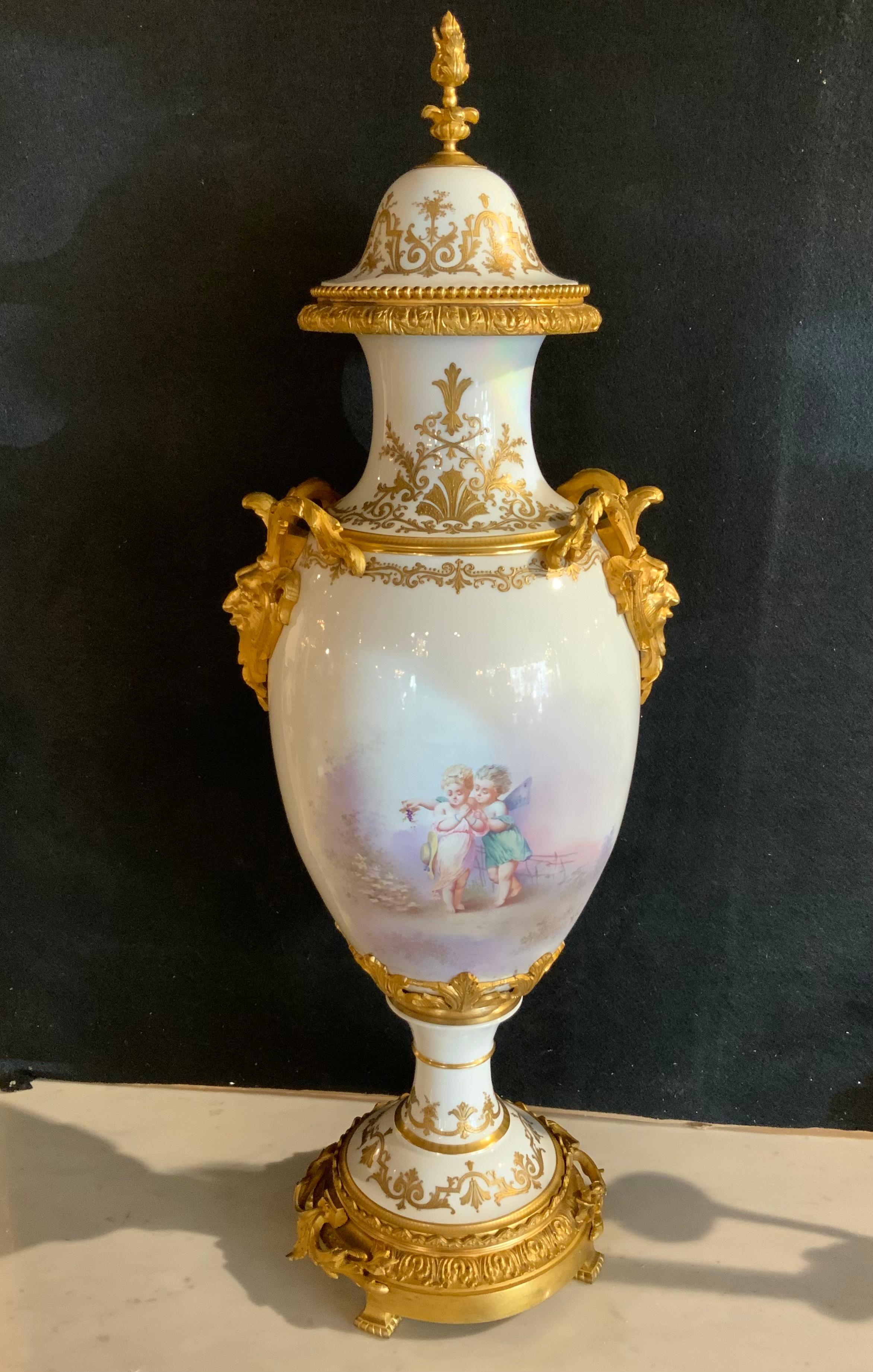 19th Century Sevres Urn 19 Th Century with Gilt Bronze Mounts and Gilt Masks, Hand Painted For Sale