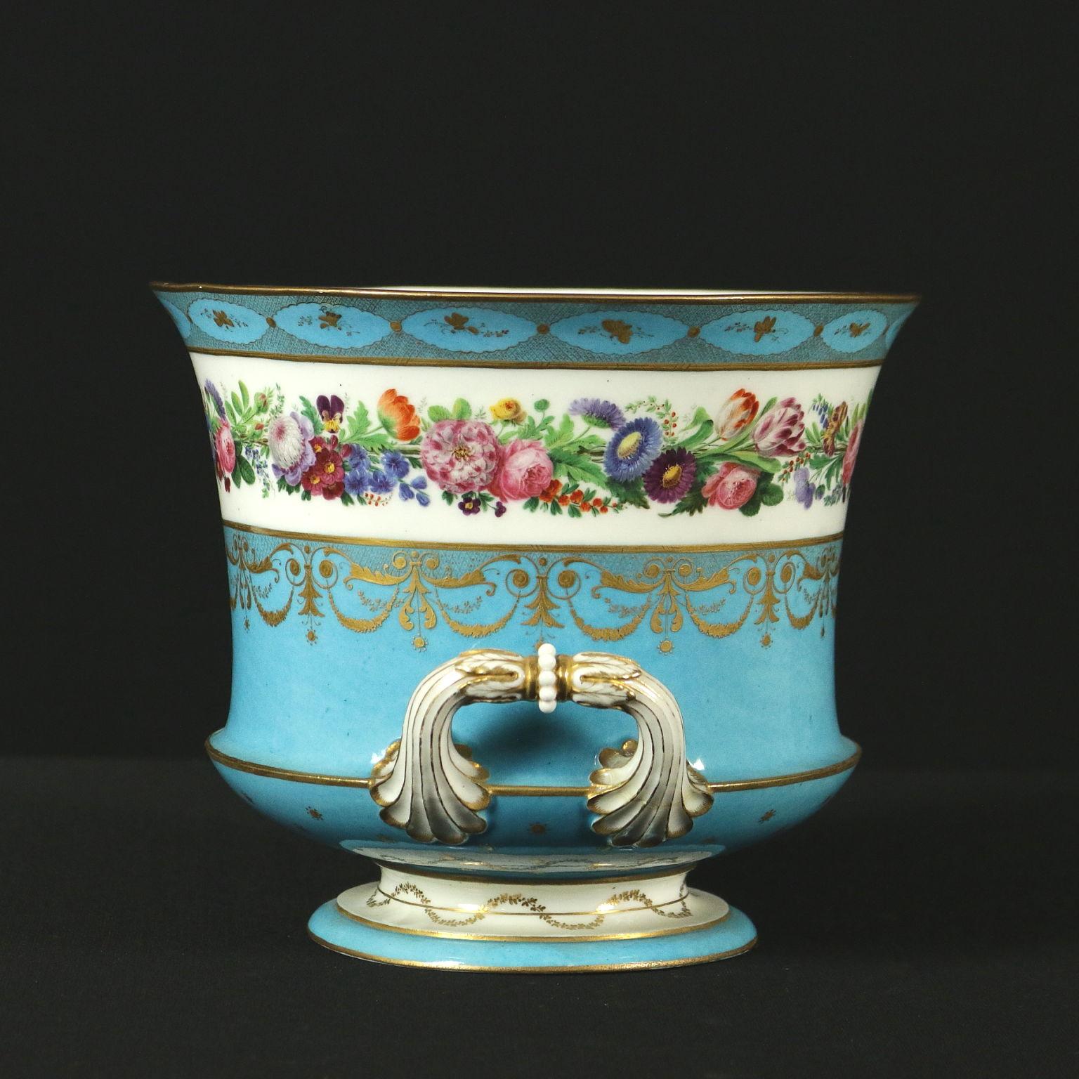 Porcelain vase with two handles, finely all-round decorated with plant and pure gold patterns. Manufacturing brand under the base.