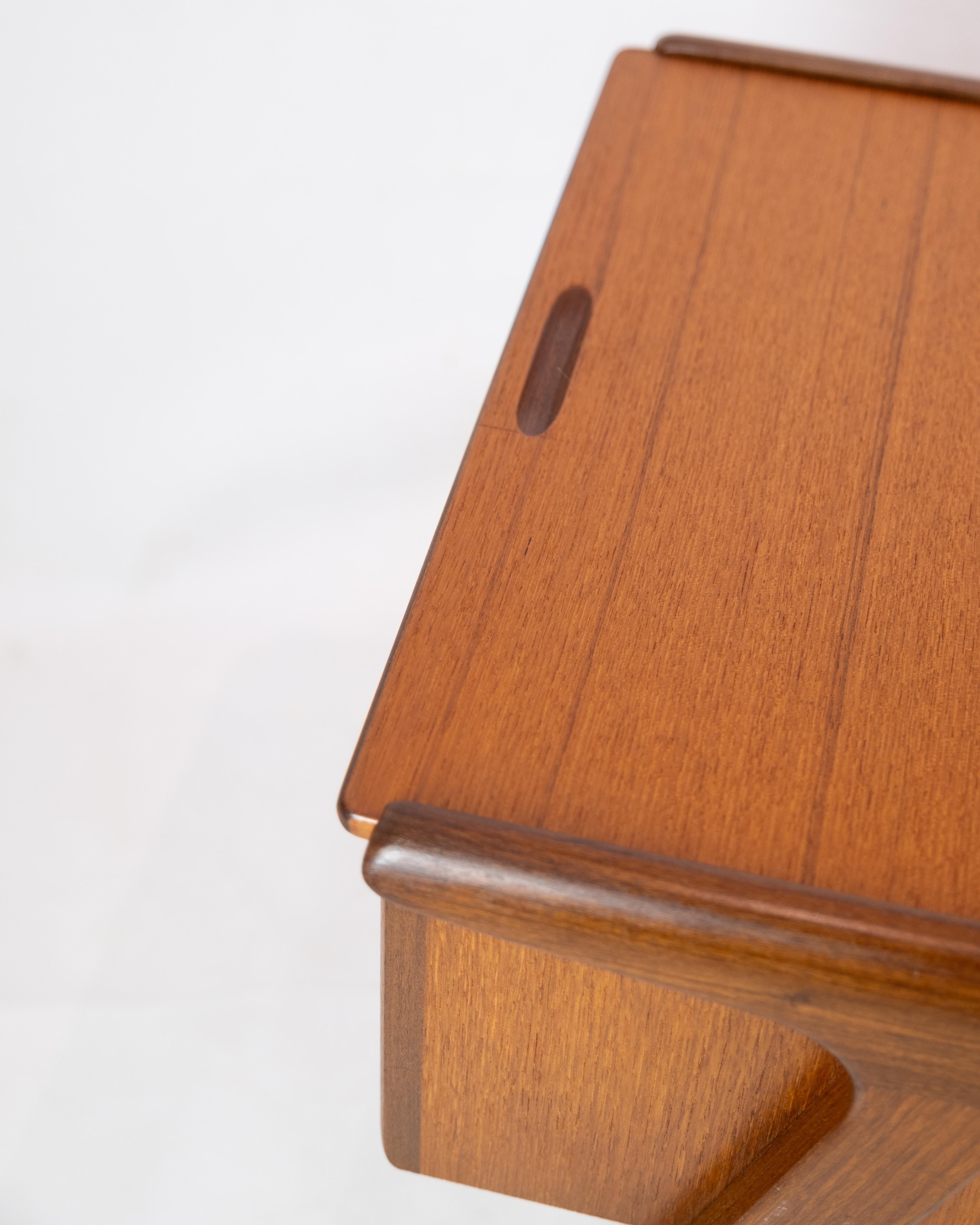 A teak sewing table with drawer from around the 1960s is a beautiful example of Danish design from the popular mid-century modern period.

The teak tree is known for its warm color and natural beauty, which makes it a popular material in Danish