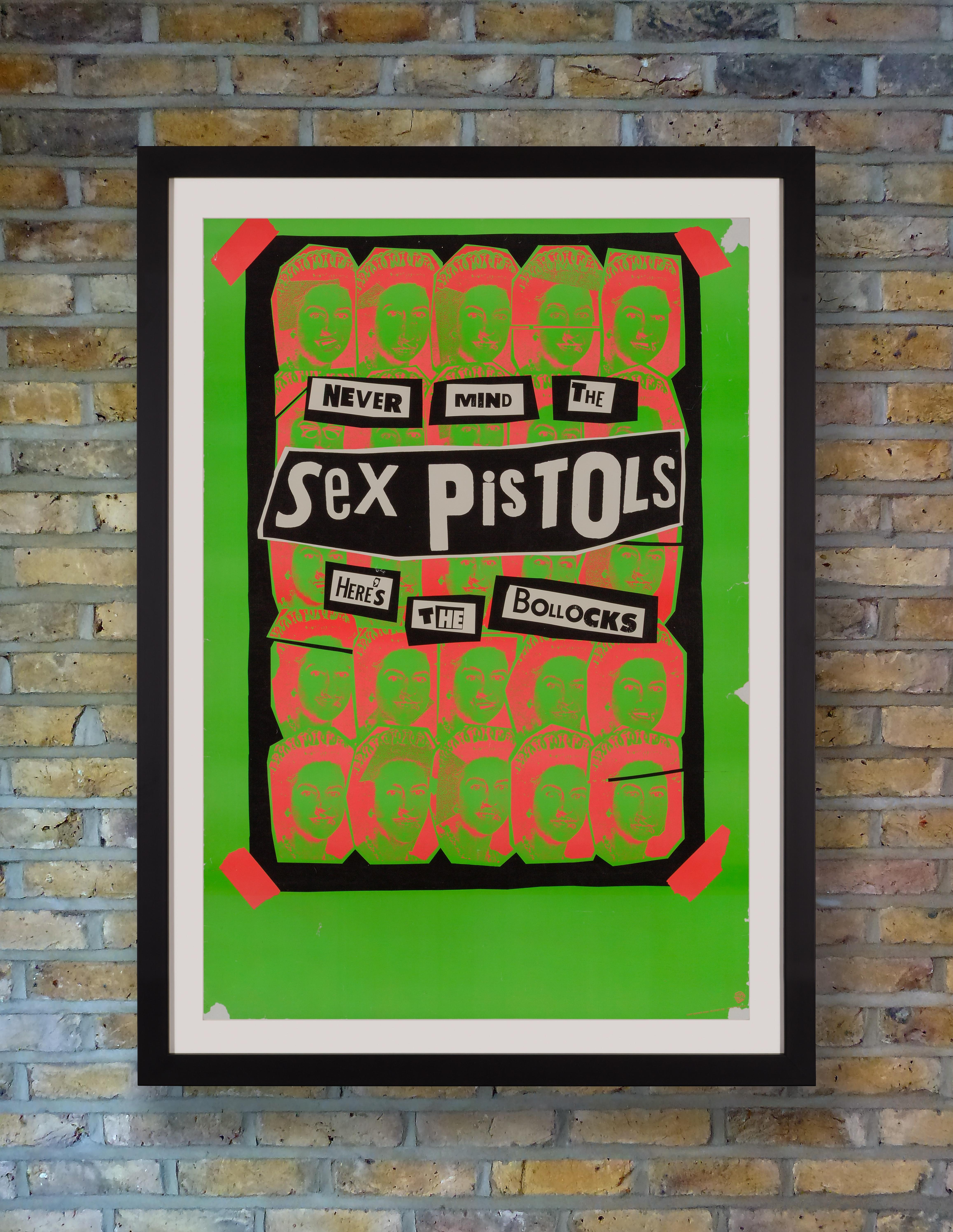 An incredibly rare Warner Bros promotional poster for the November 1977 U.S. release of the Sex Pistols only studio album 'Never Mind The Bollocks,' featuring a repeat of Jamie Reid's God Save The Queen motif in the dayglo pink and green colors of