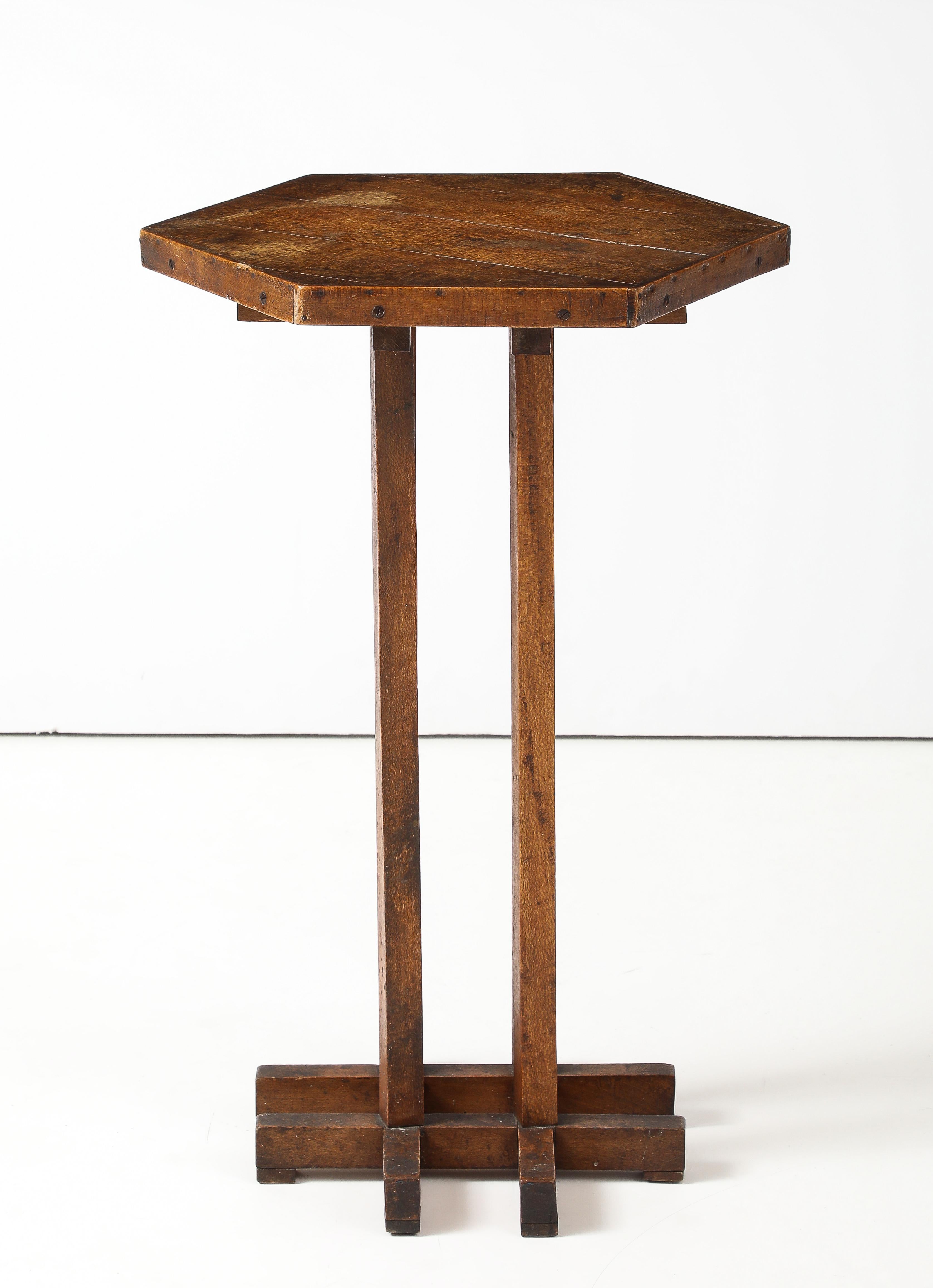 Hextogonal Walnut & Oak Table with four supports forming a grid Base, France, c. 1900-1930

H:  31 Top: 17 to 20  in.

This maker was working and looking to Macintosh & Moser.