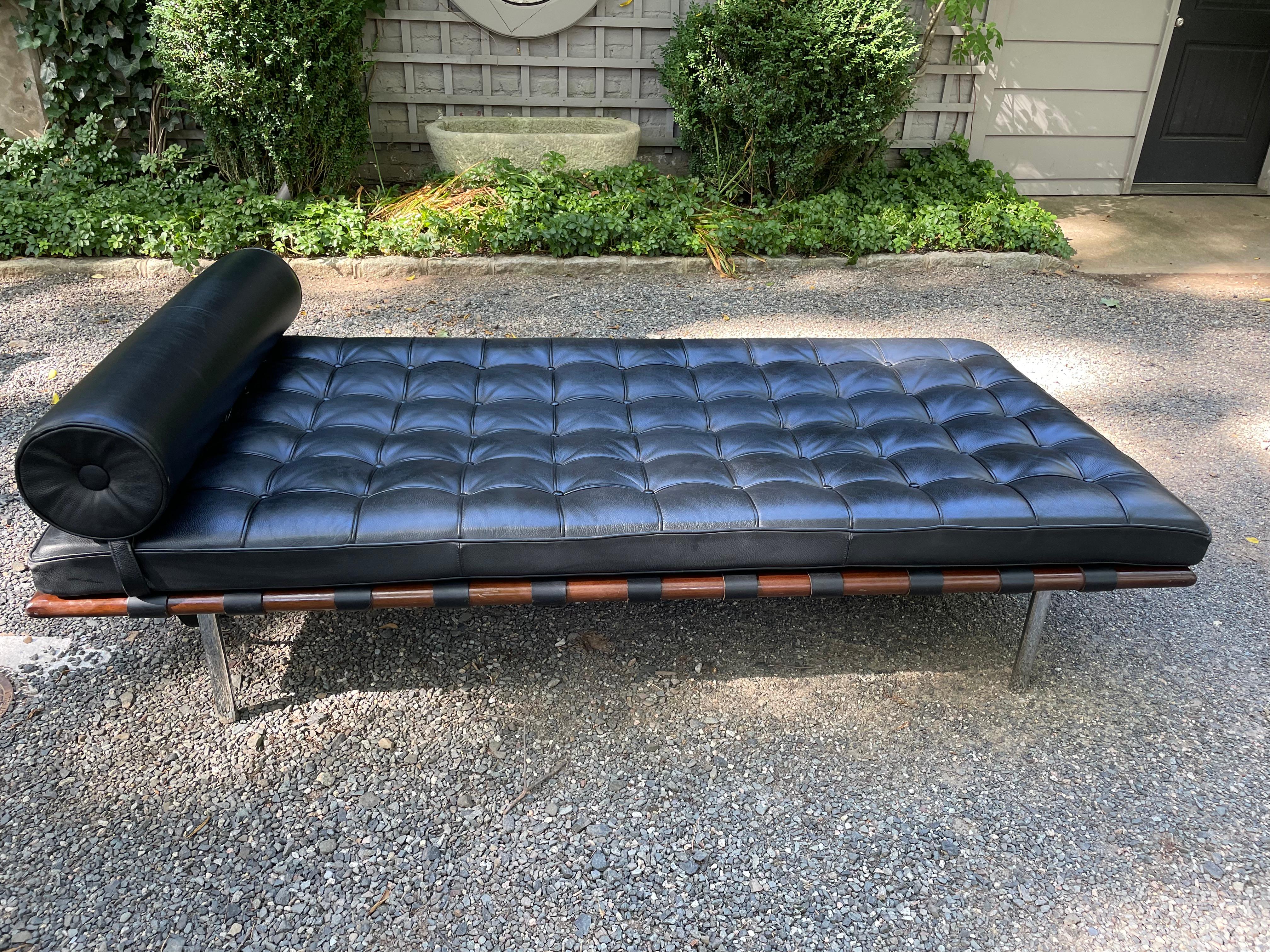 Iconic Barcelona daybed attributed to Mies van der Rohe constructed of a walnut and chromed steel frame upholstered in it’s original black leather.  No label.