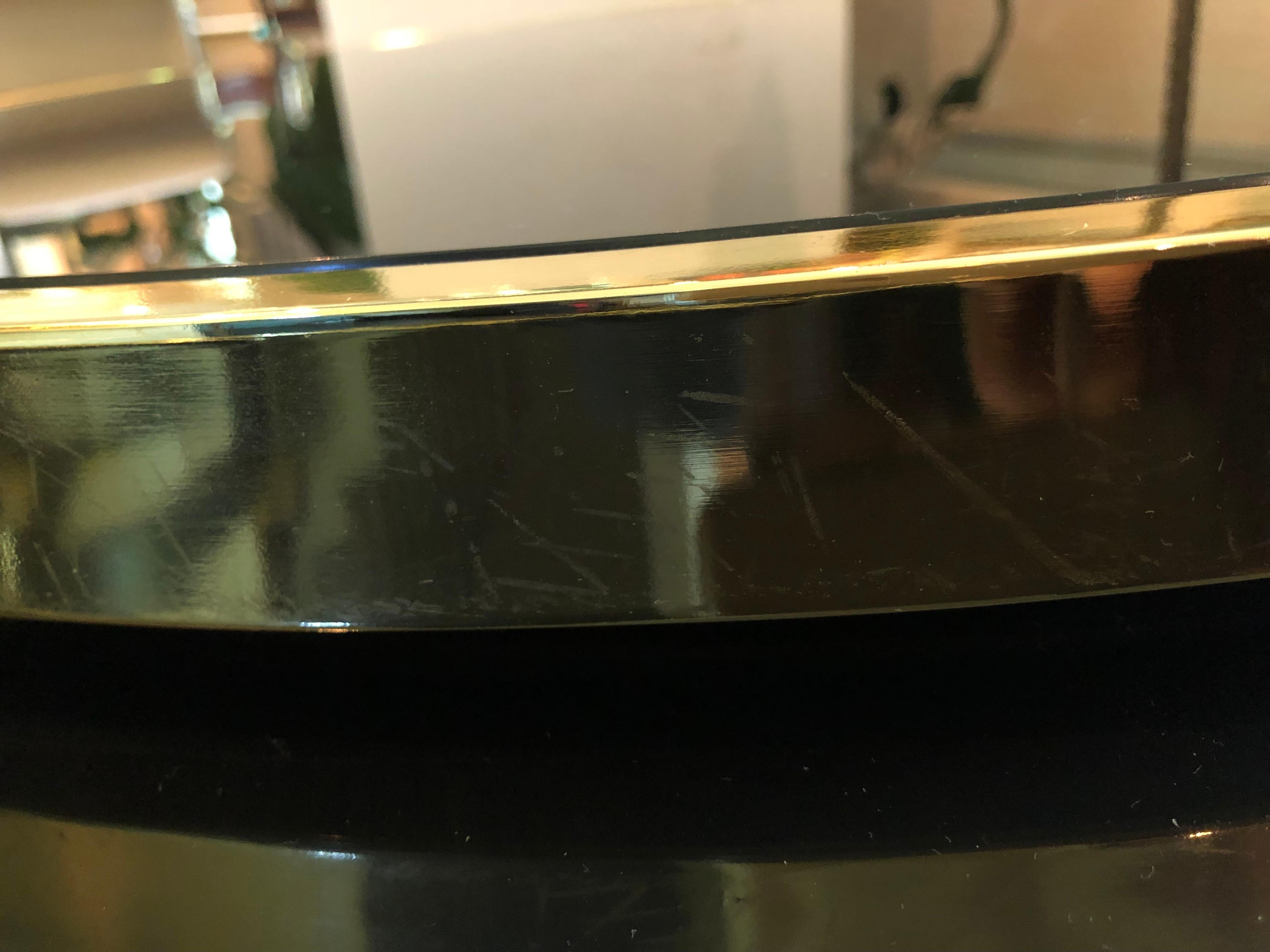 Mid-Century Modern Sexy DIA Round Two Tier Swivel Brass and Black Glass Coffee Table