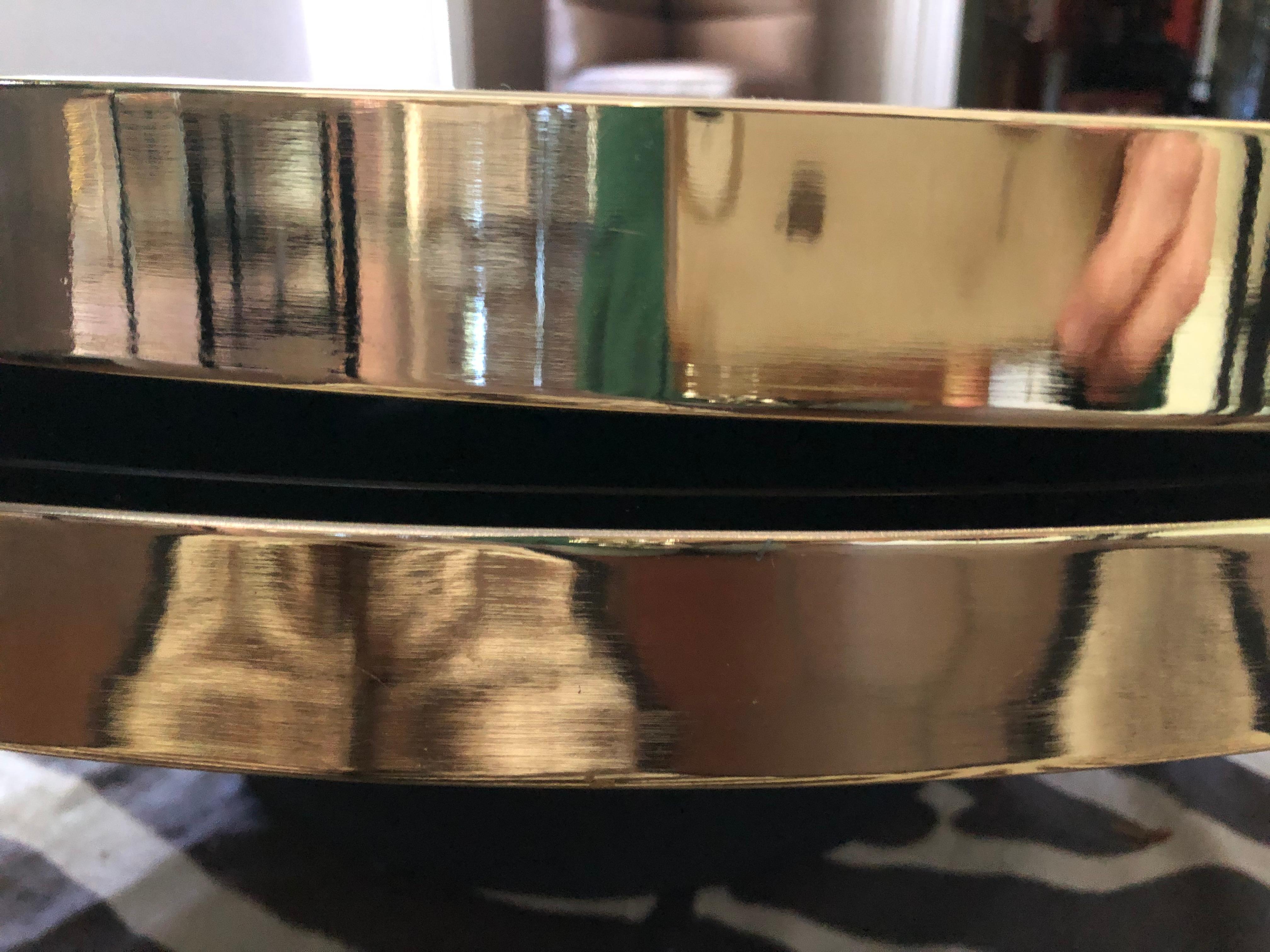 North American Sexy DIA Round Two Tier Swivel Brass and Black Glass Coffee Table