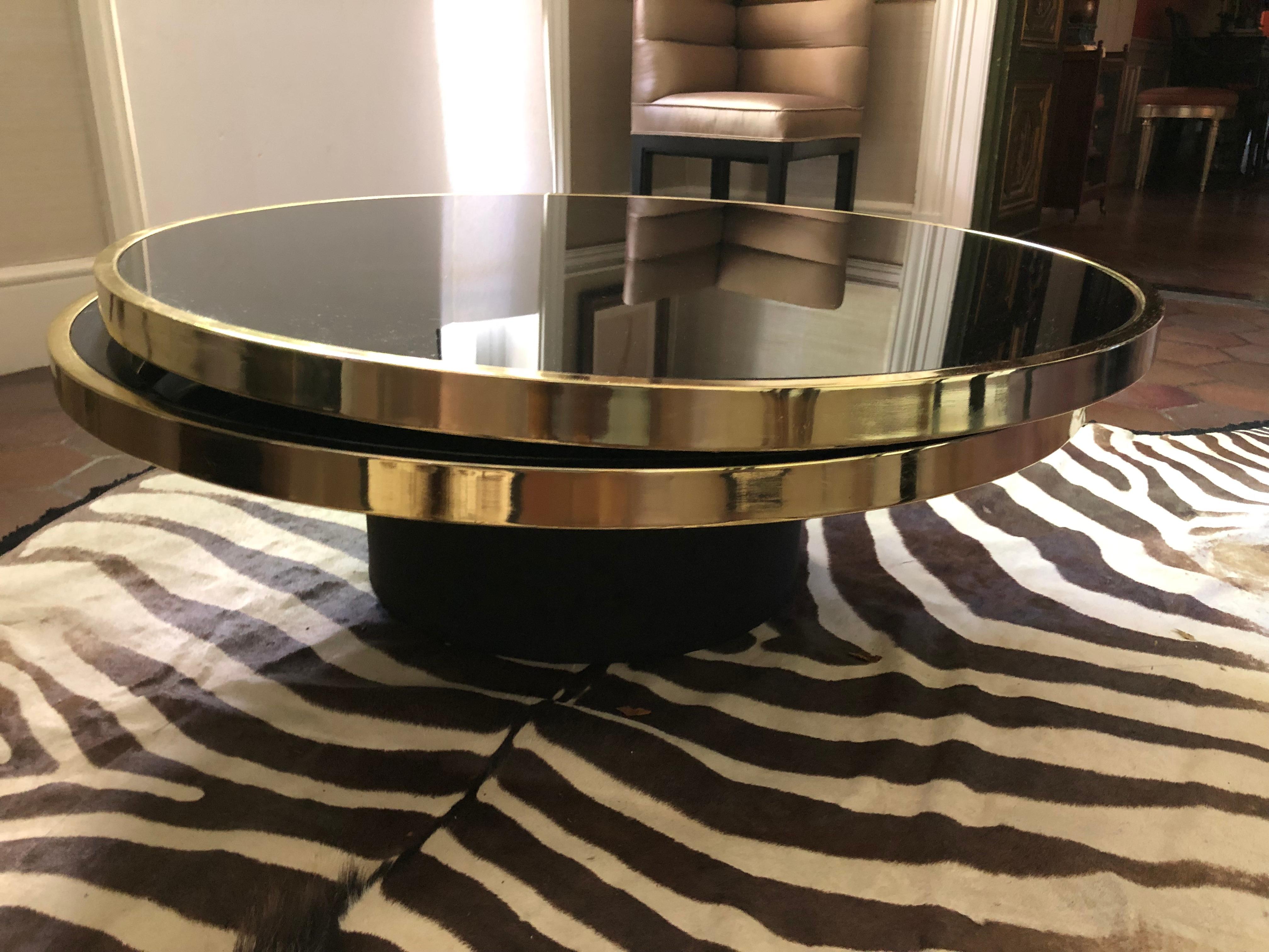 Sexy DIA Round Two Tier Swivel Brass and Black Glass Coffee Table In Good Condition In Hopewell, NJ