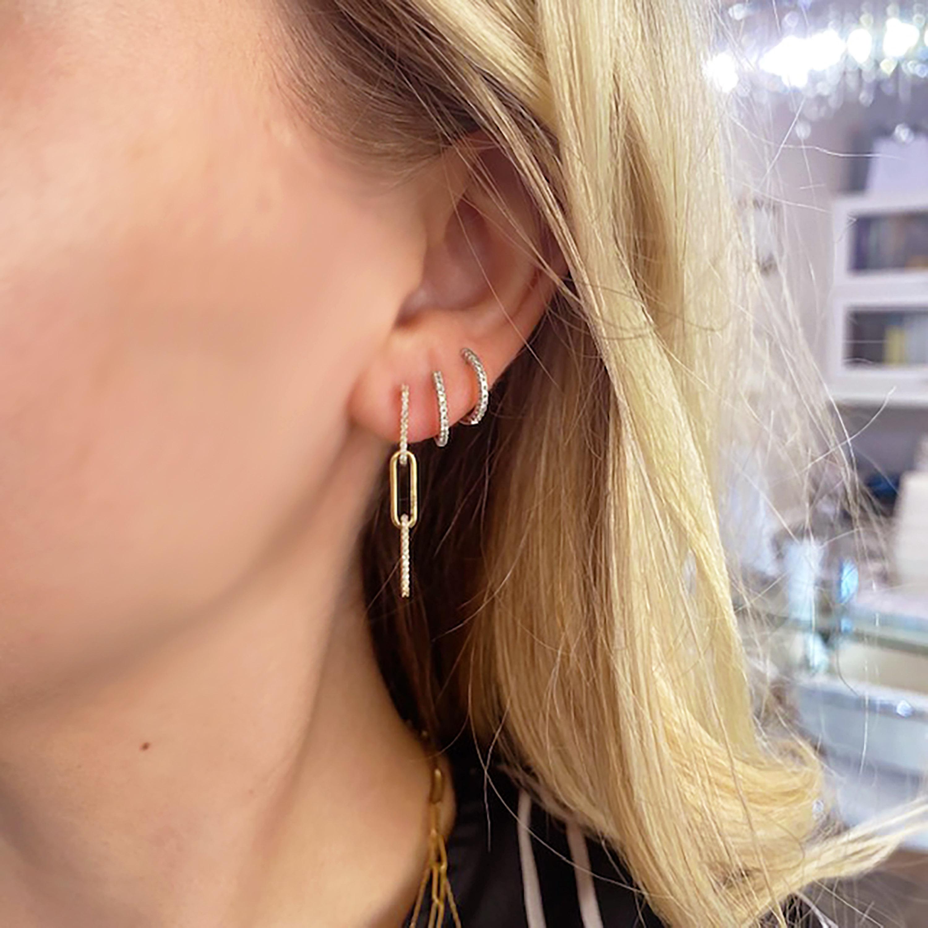 These diamond paperclip earrings have 52 full cut diamonds and are set in 14 karat yellow gold. These brilliantly designed earrings will go with your link or paperclip necklace! Feel like a million dollars when you wear these earrings.
Material: 14K