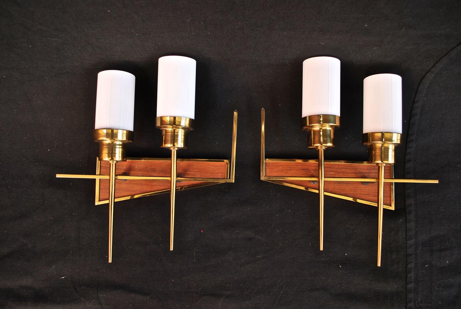 A beautiful and very sexy 1950's French sconces, the patina is much nicer in person, I believe these are Maison Arlus, we rewire all our lights and sconces, if you need a back plate to cover the electric box we provide all that at no extra cost.