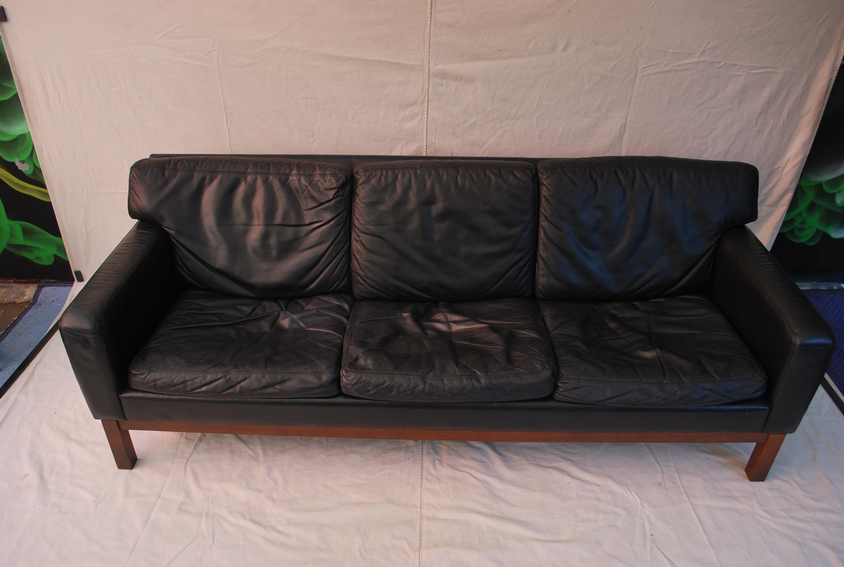 A beautiful and sexy leather sofa design by Erik Jorgensen, the patina of the leather is so much nicer in person