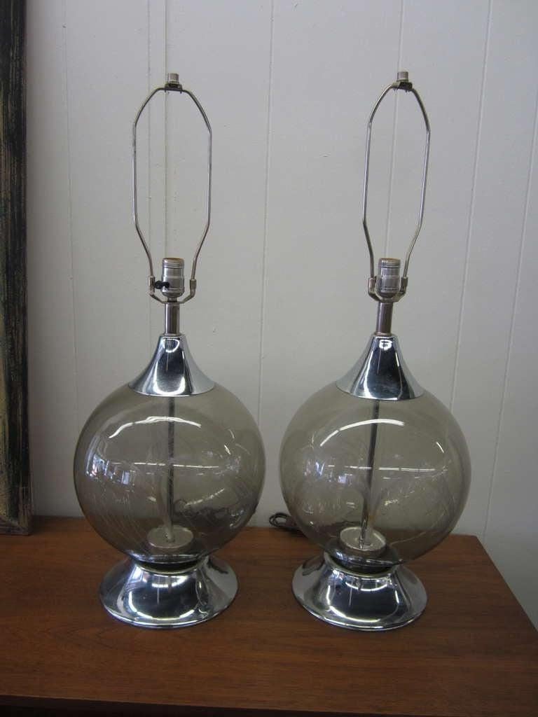 
 This fun and amazing pair of fiber optic globe lamps from the 1970's are constructed of chrome metal,smoked glass and fiber optics. Thousands of optical fiber tips come alive creating a beautiful ambience. It's like gazing up at the stars. Turn