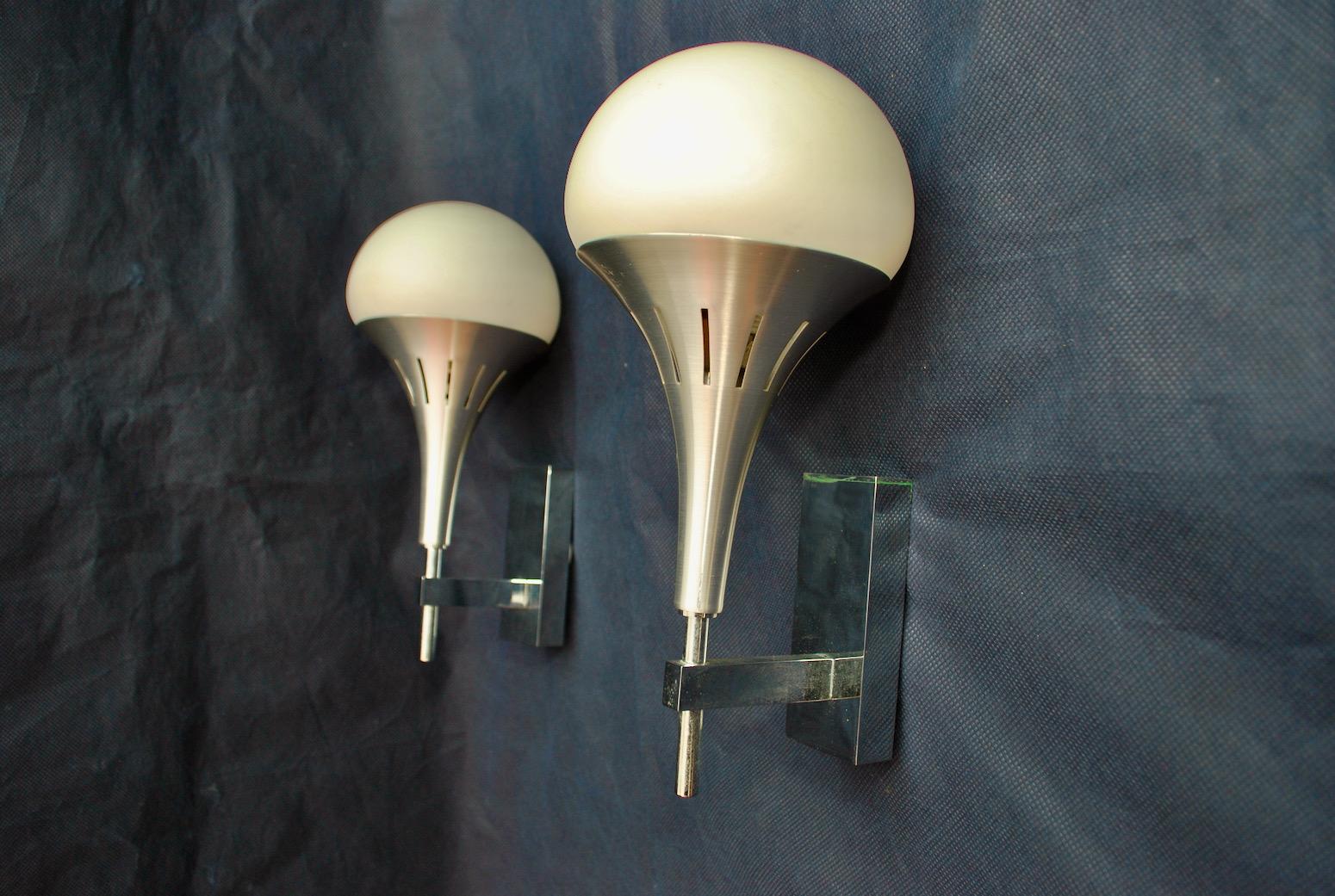 A beautiful and Elegant pair of 1970's sconces, design by Sciolari, the glass is white, see on one picture, I don't know why but on the pictures it appears cream color, when actually it is white.