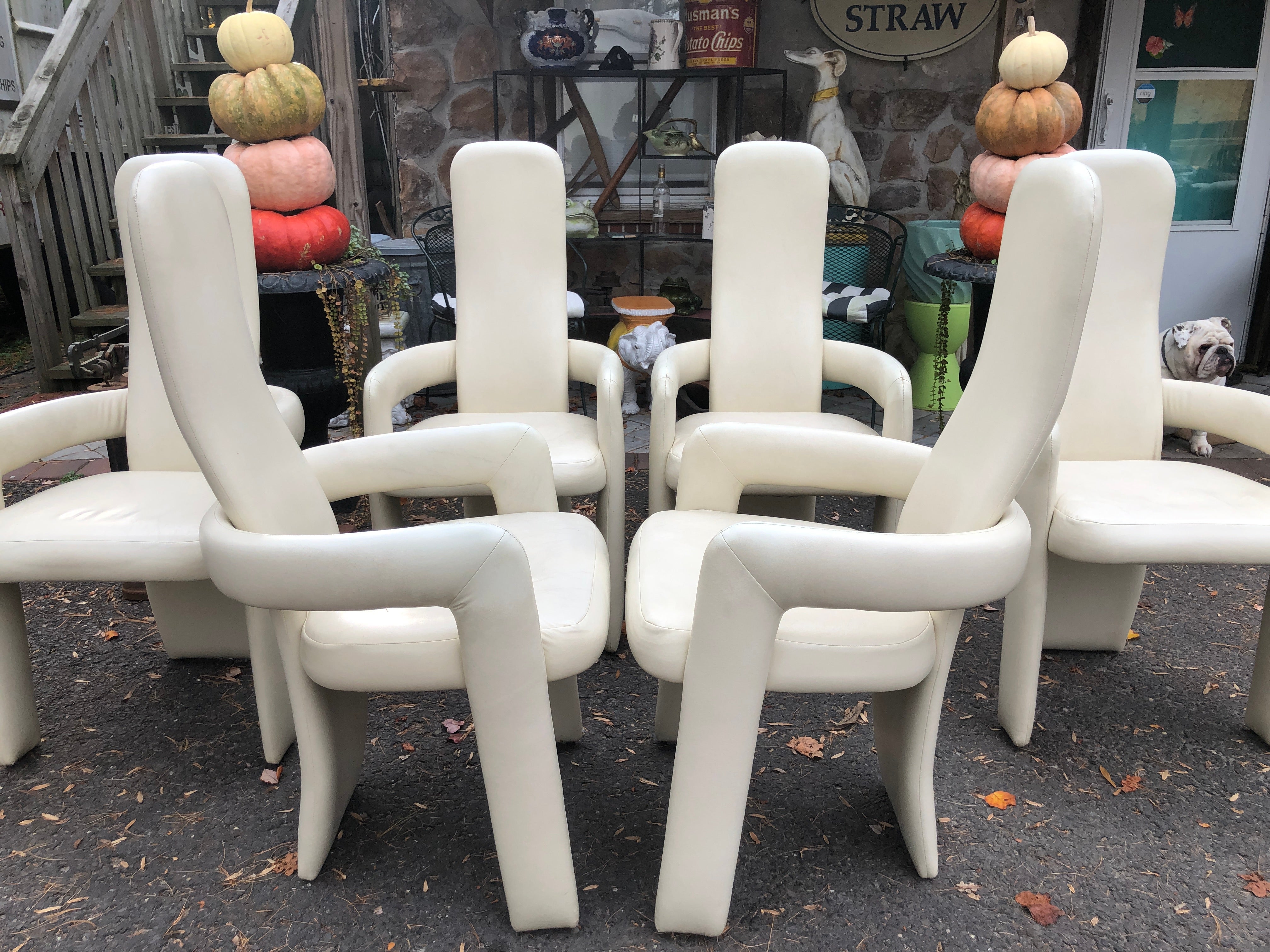 Stunning statuesque set of 6 Postmodern tall back dining chairs, four side chairs and two armchairs. They each have tall, narrow backs with rounded top corners and a lumbar curve, extending down to the floor, while the seat is nestled in a curved