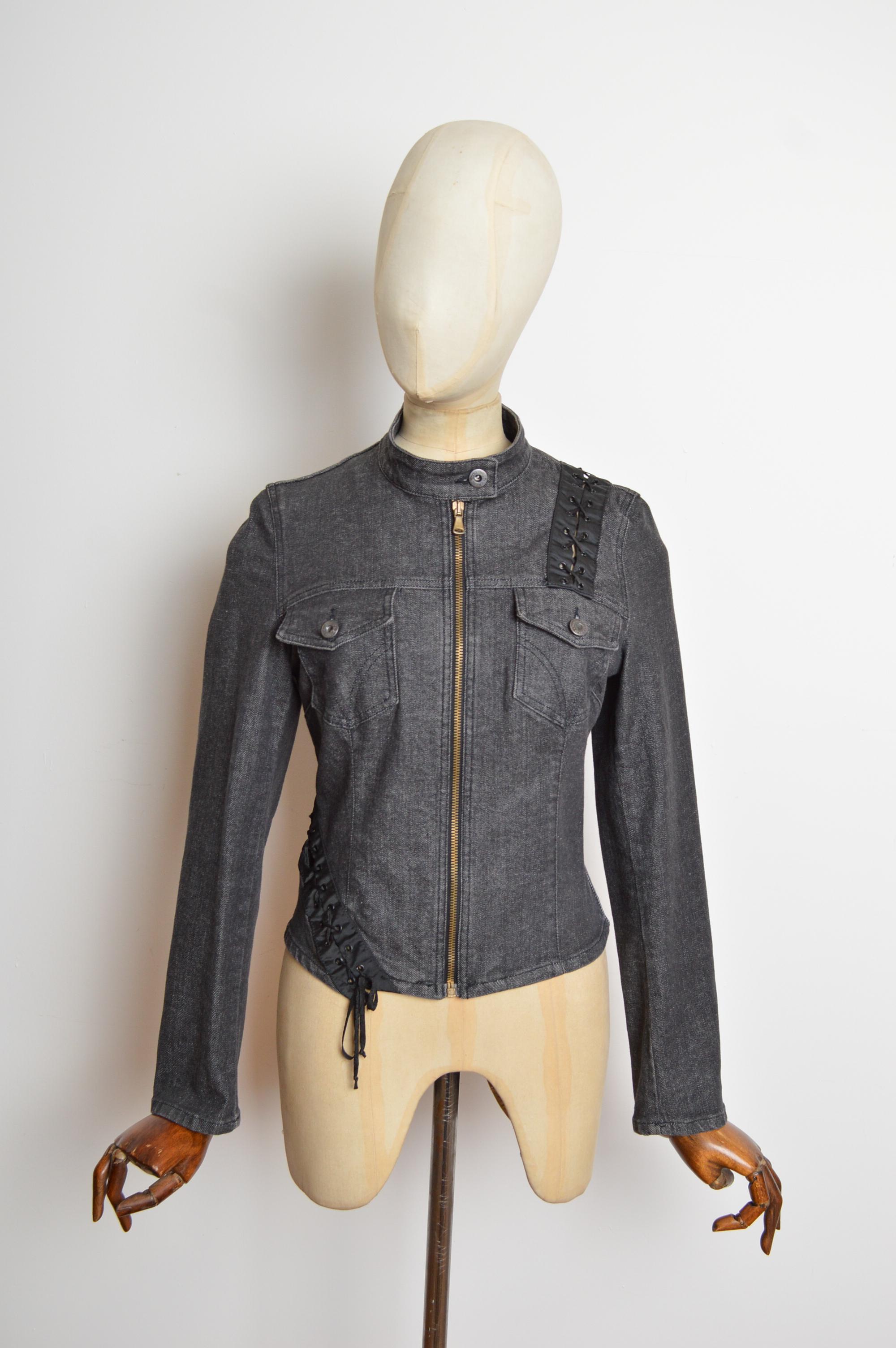 A fabulous 2000’s Charcoal grey fitted denim jacket by Dolce & Gabbana, with lace up corset-style detail around the body, press stud collar and Zip front closure.  
MADE IN ITALY.
Recommended Size; 
Measurements are provided in inches (‘’)