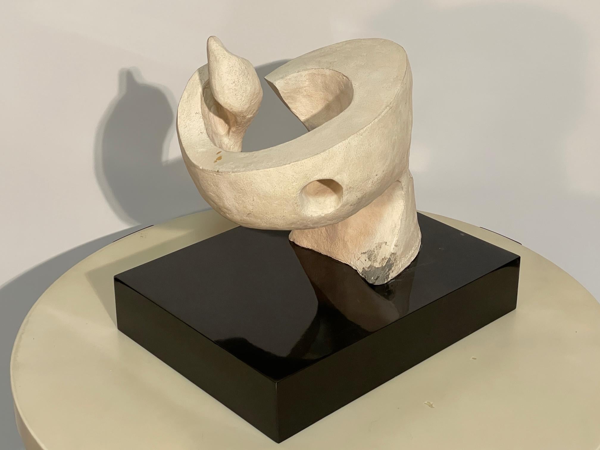 Sculptor Seymour F Rosenwasser (aka Sy Rosenwasser) is known for his abstract modernist work with plaster and bronze.  This untitled abstract plaster piece flows up from the base then abruptly changes direction into a swirling organic movement