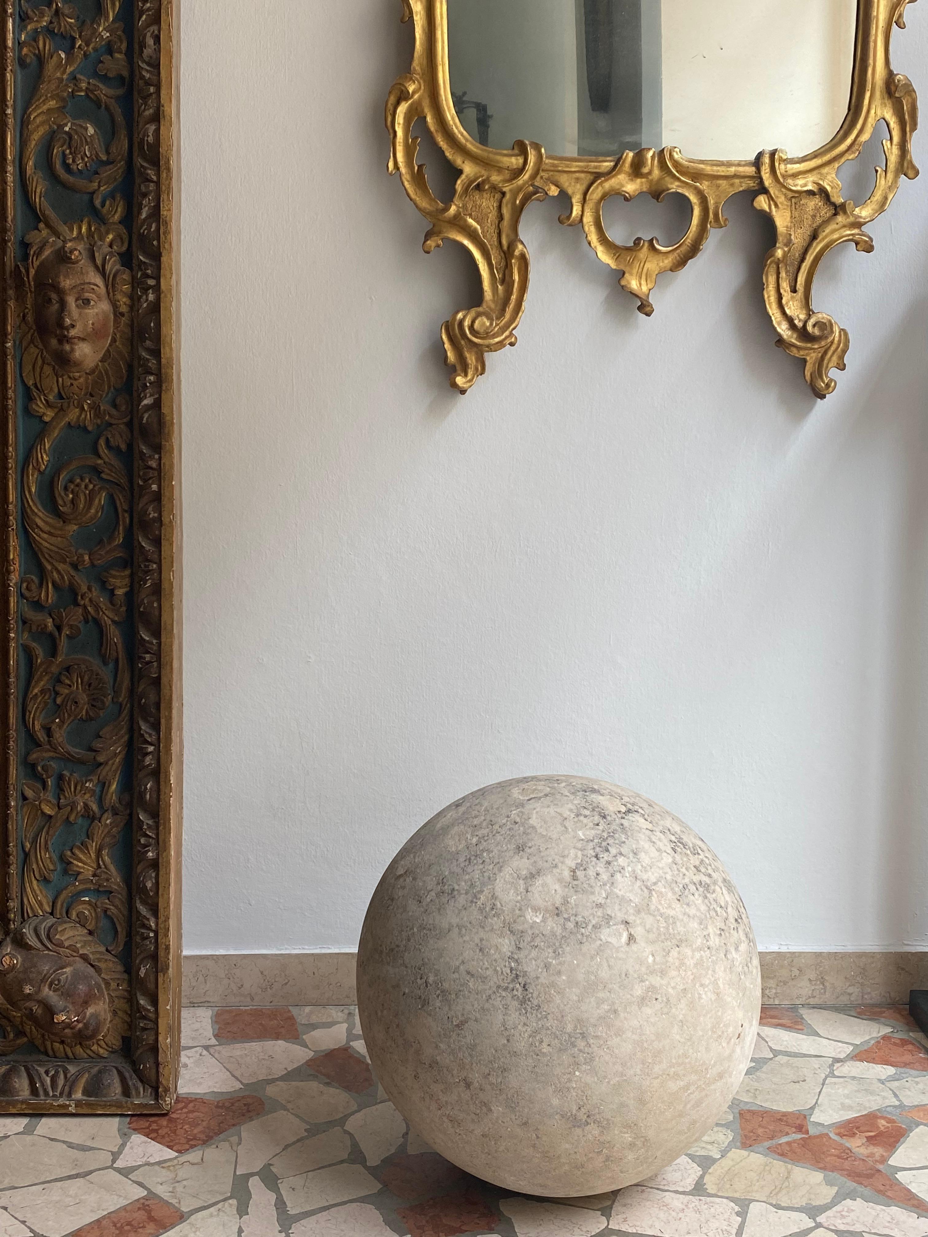 Seventeenth-century sandstone sphere, Apulia (Italy). This is a decorative sphere made of sandstone, a sedimentary rock formed by small compacted grains of sand.Its surface is rough and the stains present are due to exposure to weathering. This