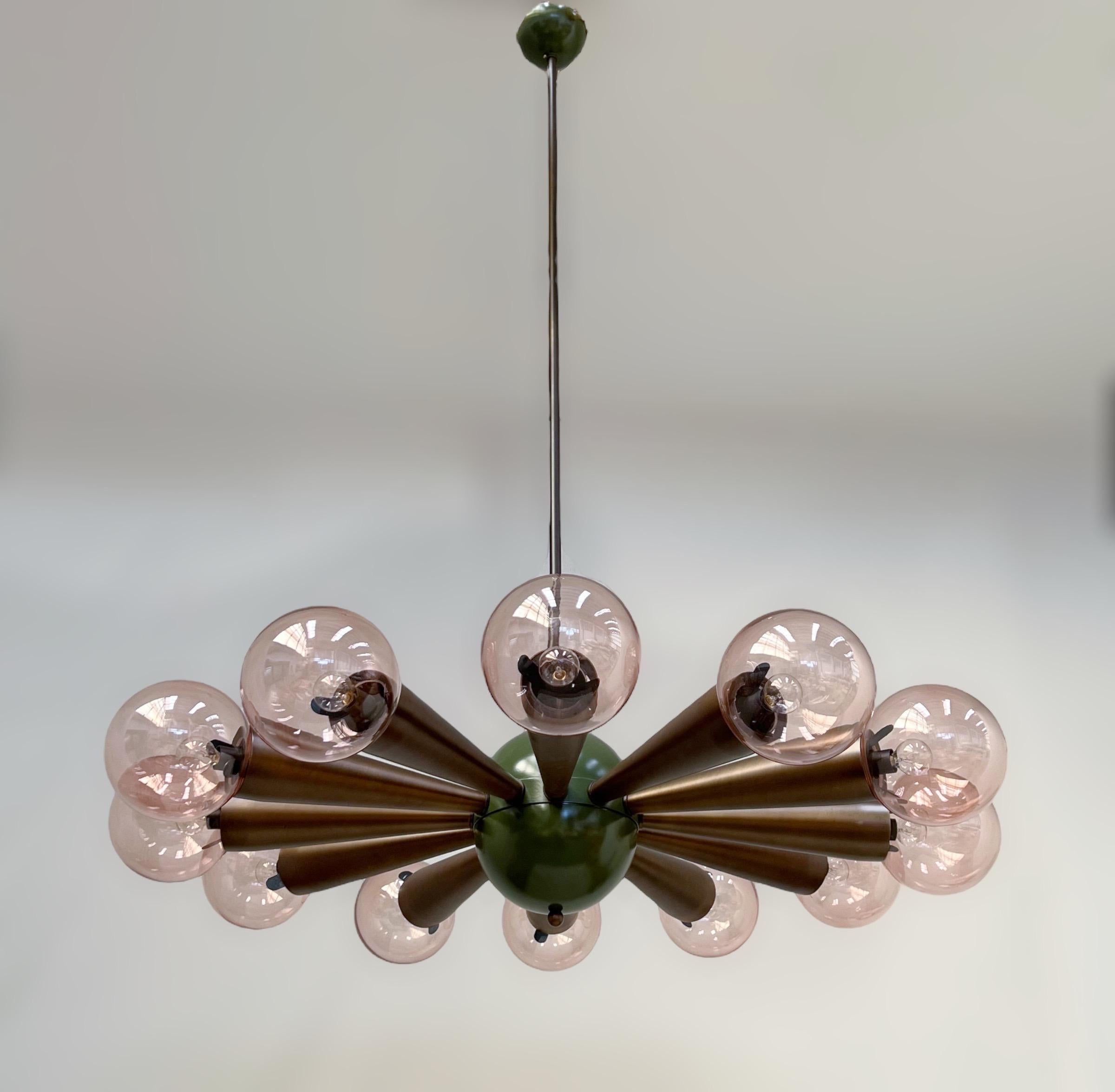 Italian chandelier with transparent pink coral colored Murano glass orbs, mounted on bronzed frame / Designed by Fabio Bergomi for Fabio Ltd / Made in Italy
12 lights / E12 or E14 type / max 40W each
Measures: Diameter 43 inches / Height 66 inches
