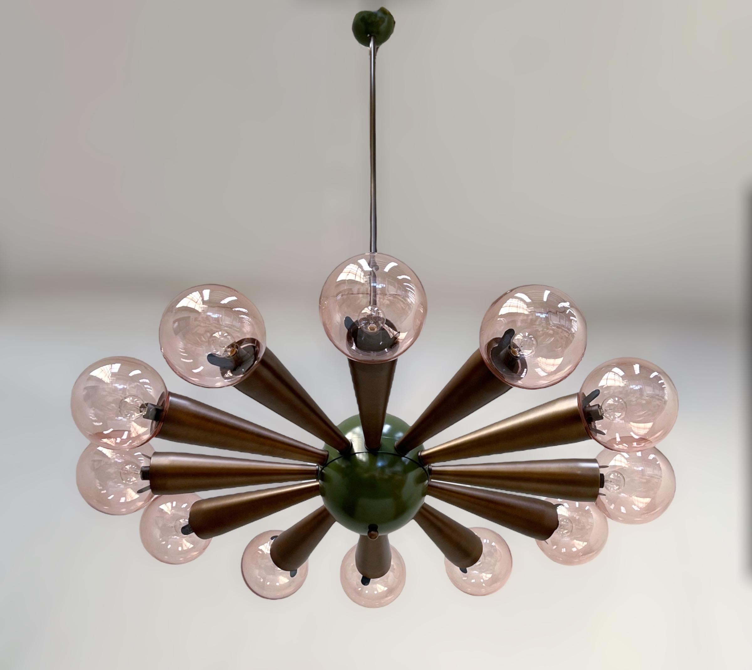 Italian chandelier with transparent pink coral colored Murano glass orbs, mounted on bronzed frame / Designed by Fabio Bergomi for Fabio Ltd / Made in Italy
12 lights / E12 or E14 type / max 40W each
Measures: Diameter 43 inches / Height 66 inches