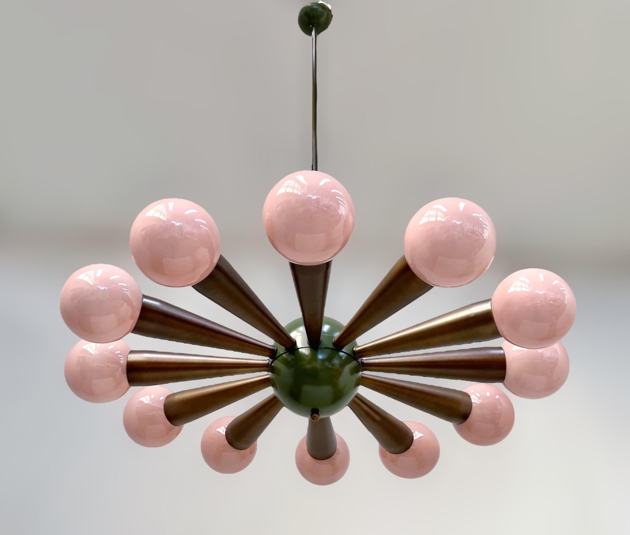 Italian chandelier with opaque pink coral colored Murano glass orbs, mounted on bronzed frame / Designed by Fabio Bergomi for Fabio Ltd / Made in Italy
12 lights / E12 or E14 type / max 40W each
Measures: Diameter 43 inches / Height 66 inches
