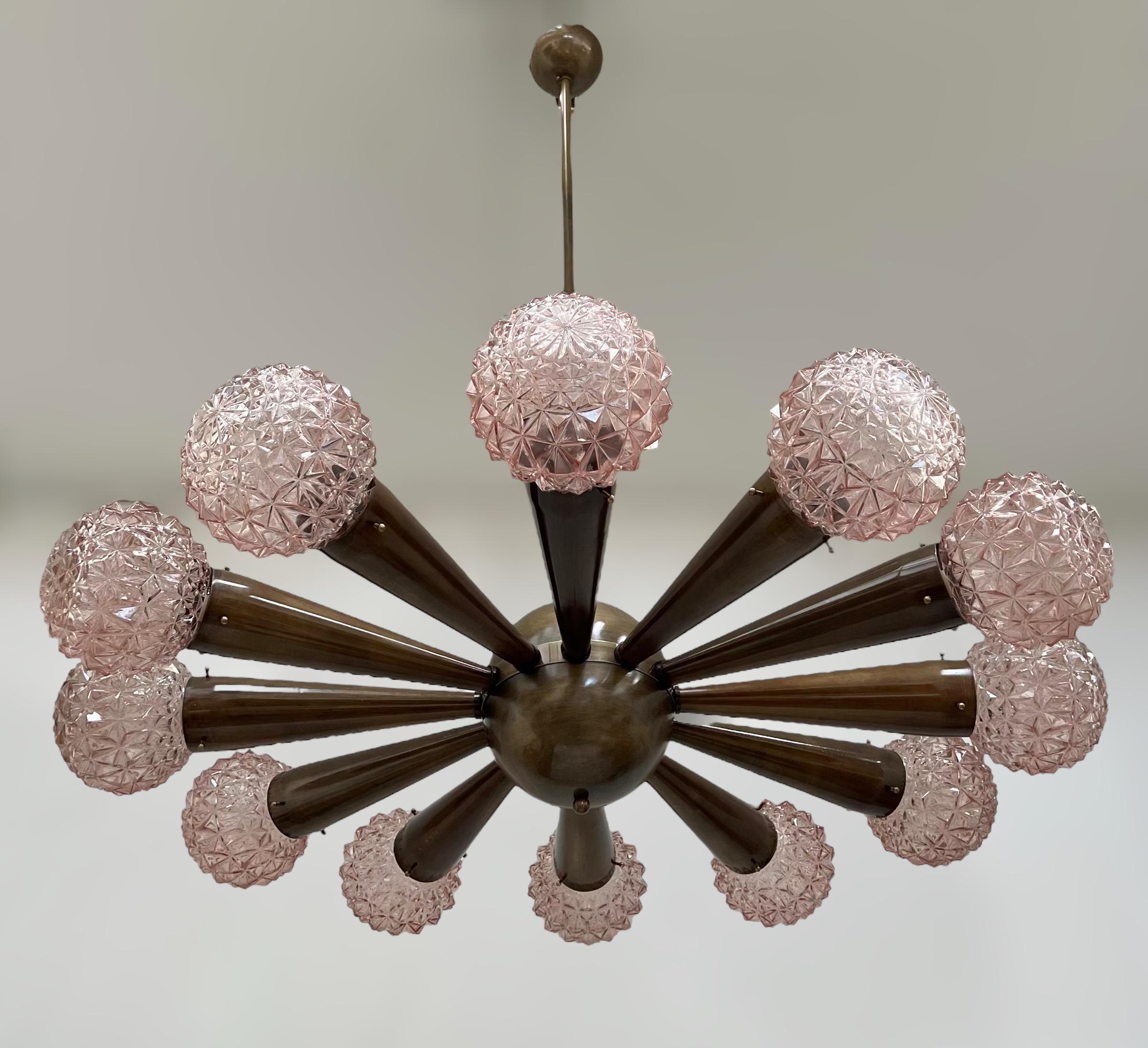 Italian chandelier with pink faceted Murano glass shades, mounted on bronzed finish frame / Designed by Fabio Bergomi for Fabio Ltd / Made in Italy
12 lights / E12 or E14 type / max 40W each
Measures: Diameter 43 inches / Height 49 inches including