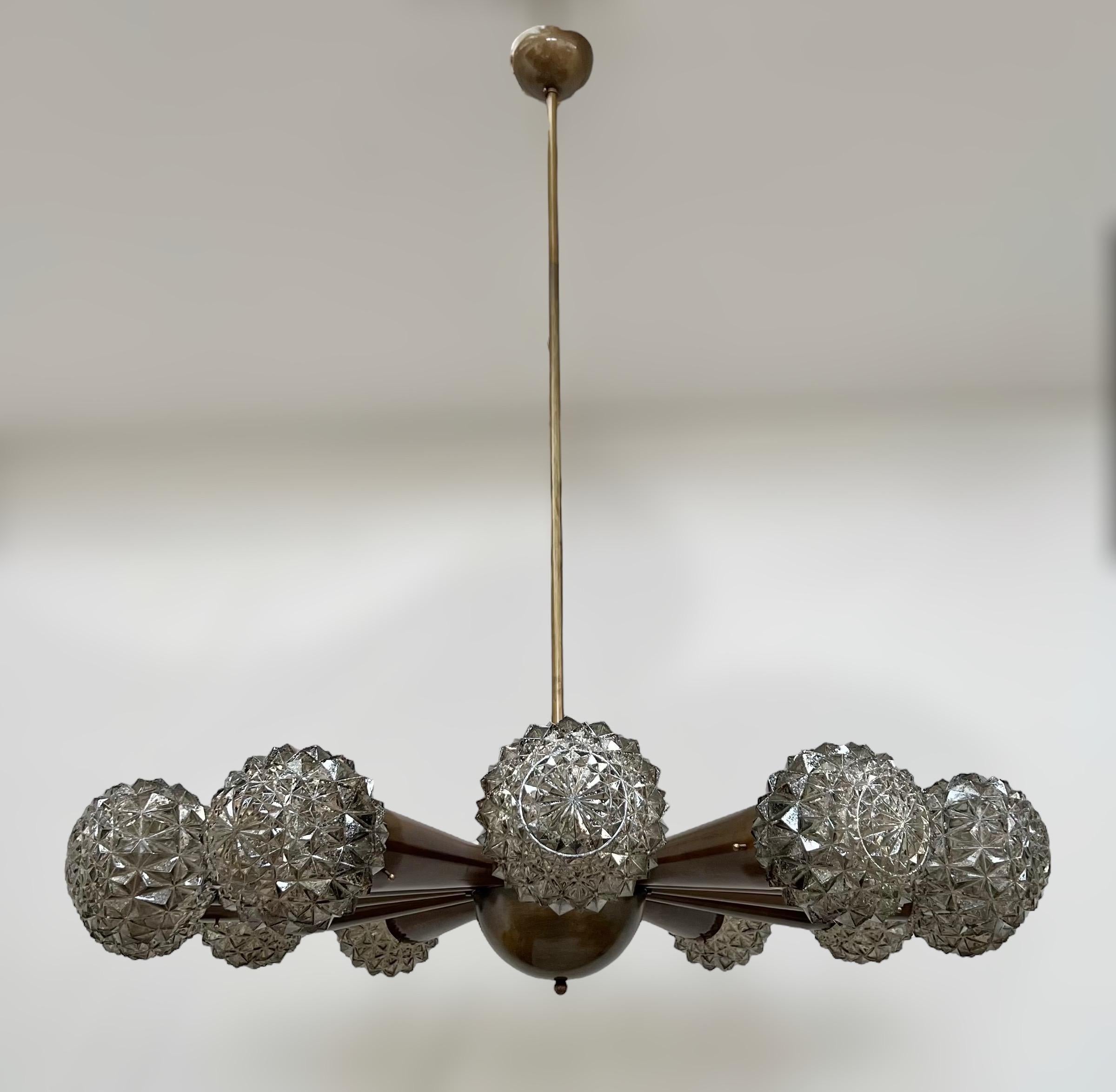 Italian chandelier with smoky faceted Murano glass shades, mounted on bronzed finish frame / Designed by Fabio Bergomi for Fabio Ltd / Made in Italy
12 lights / E12 or E14 type / max 40W each
Measures: Diameter 43 inches / Height 49 inches including