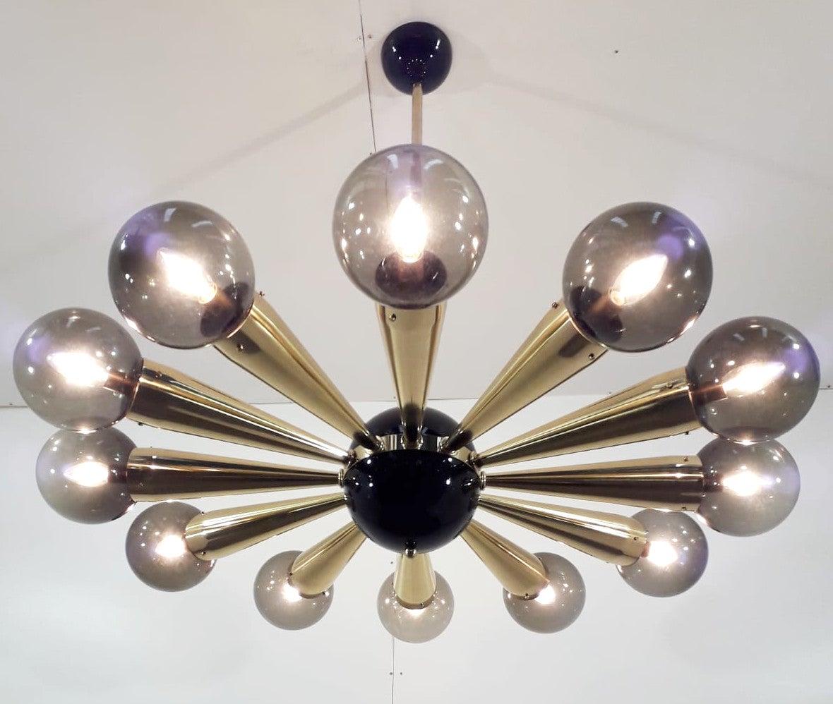 Italian chandelier with smoky Murano glass globes mounted on polished brass frame with black enameled center and ceiling canopy / Designed by Fabio Bergomi for Fabio Ltd / Made in Italy
12 lights / E12 or E14 type / max 40W each
Measures: Diameter