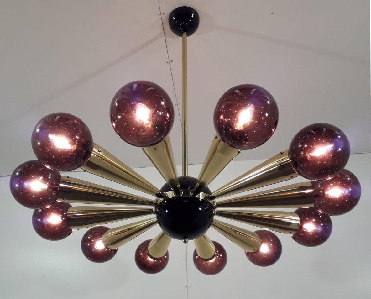 Italian chandelier with amethyst Murano glass globes with carefully blown bubbles within the glass using Bollicine technique, mounted on polished brass frame with black enameled center and ceiling canopy, designed by Fabio Bergomi for Fabio Ltd,