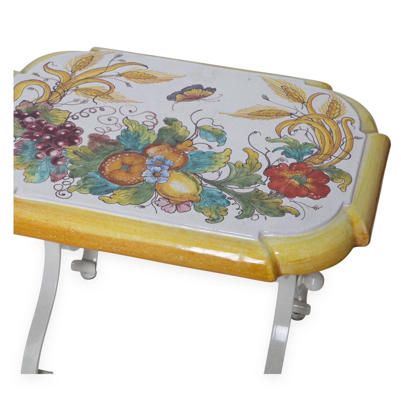 Rare maiolica stool decorated and hand painted with an original design, in characteristic antimony yellow, by the master ceramic artists of Manetti e Masini in Florence. A piece that will be immediately noticed in a rustic Italian kitchen or garden,