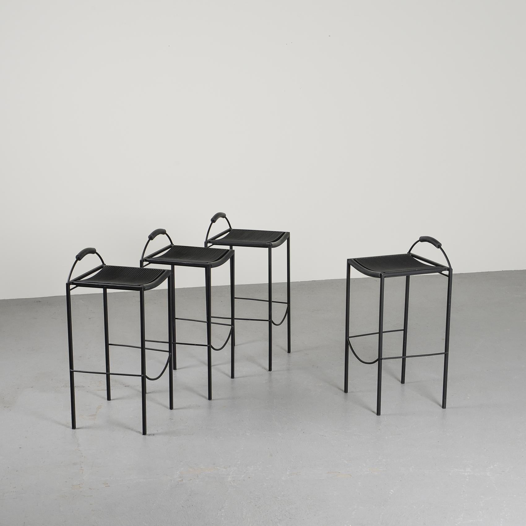 Set of four stackable Sgabello bar stools by Maurizio Peregalli for Zeus, circa 1990. 

The slender seat is finished in caoutchouc black on a steel base with black rubber finishes, very elegant. 

Seat height 72 cm.

Manufacturer : Zeus,