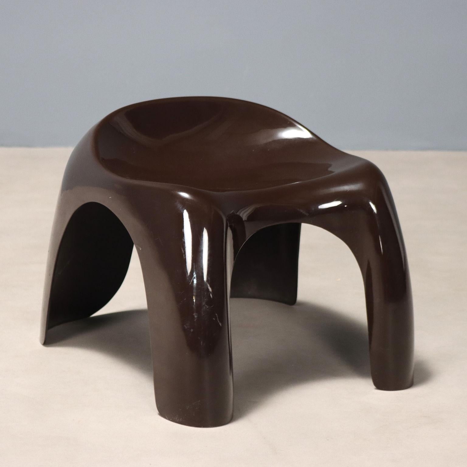 Small stool made of brown plastic material.