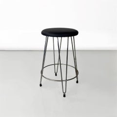 Taburete moderno italiano de polipiel negra y acero, años 70