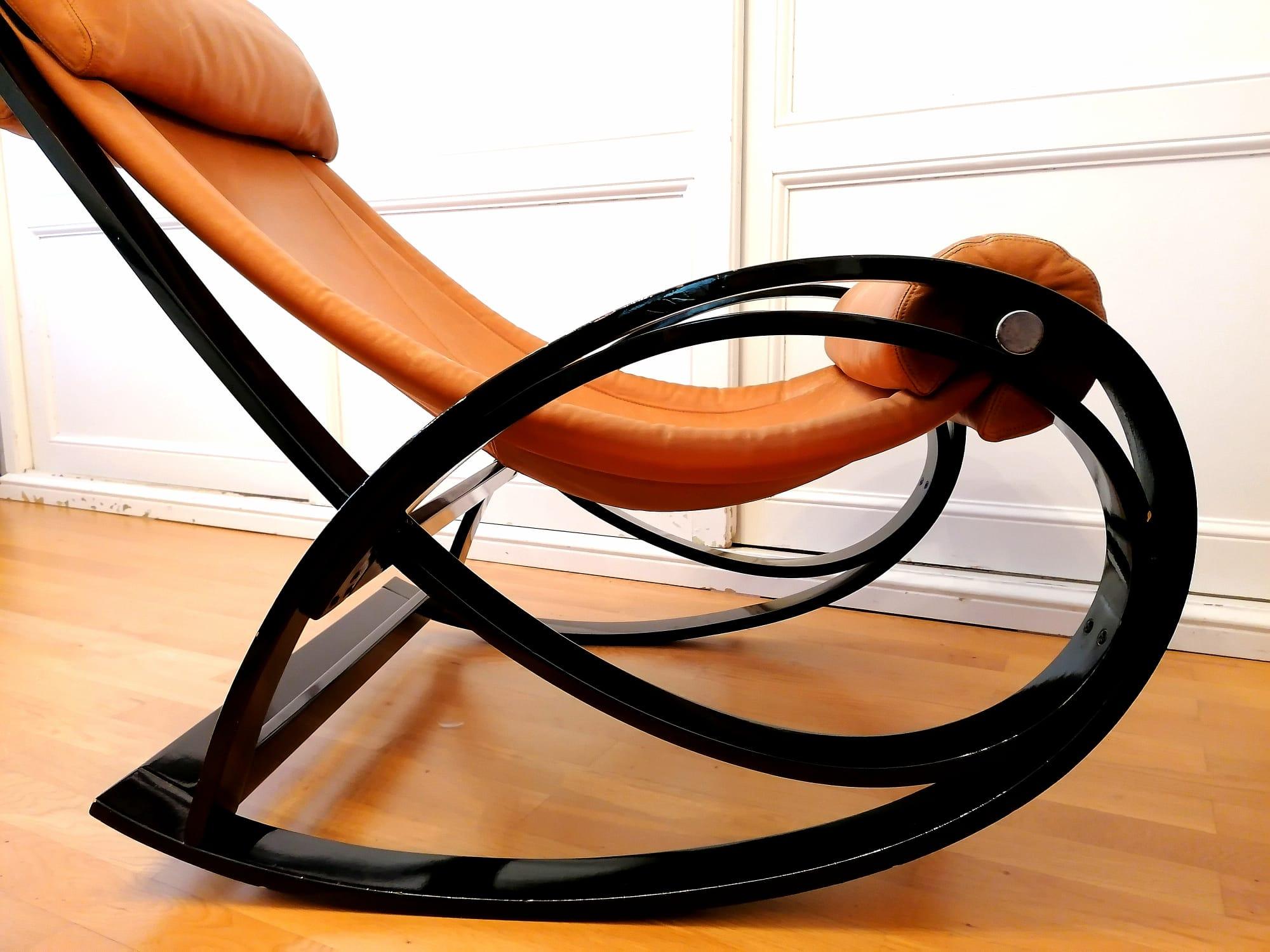Sgarsul rocking chair by Gae Aulenti from Poltronova, Italy, 1960s.
Rocking armchair in curved and lacquered black rosewood, with headrest and seat padded and covered with cognac leather, Sgarsul is confortevol and iconic piece that represent the