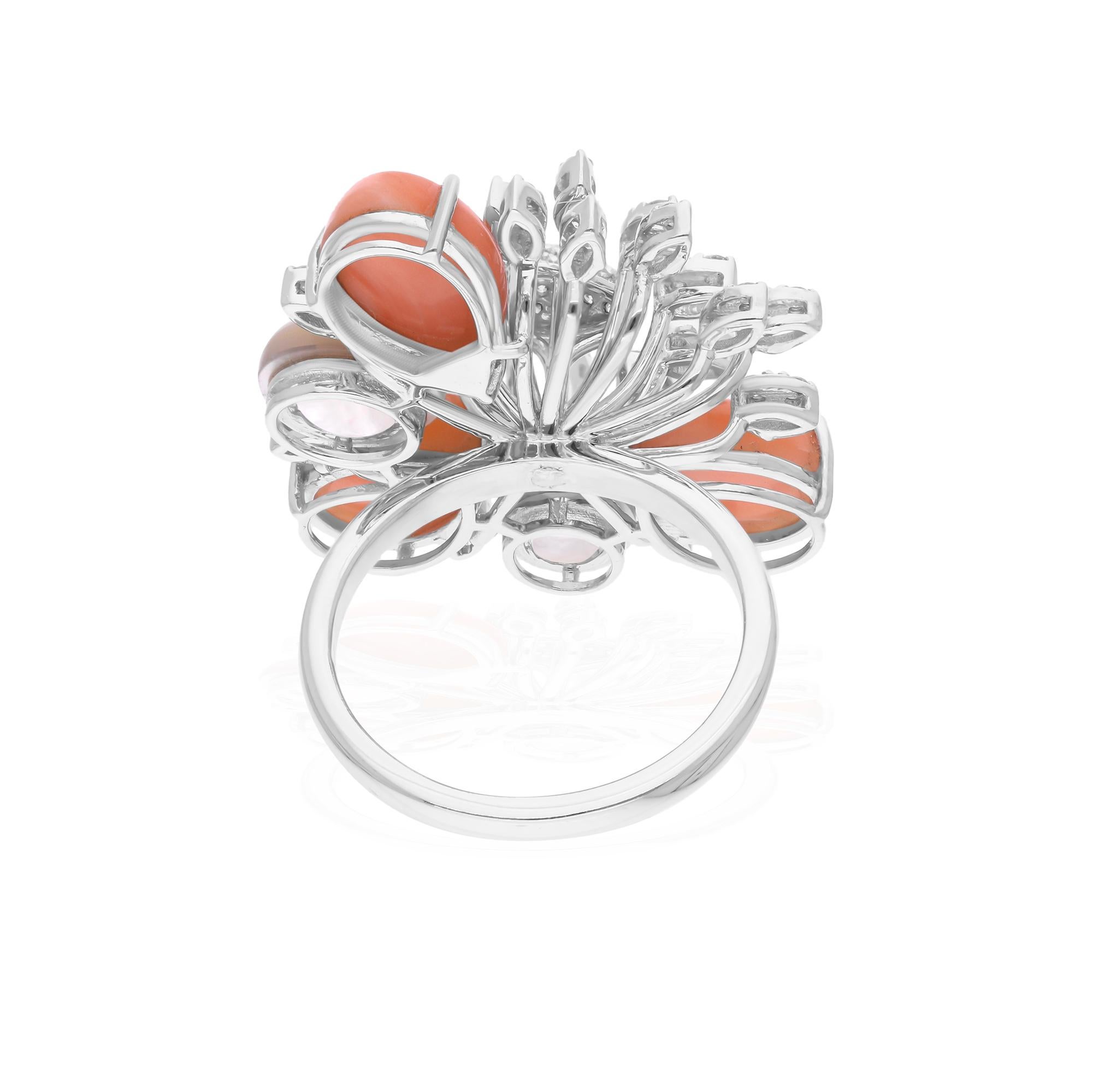 Cast from 18-karat gold, these exquisite ring is handset with 6.40 carats coral, 3.32 carats mother of pearl gemstone and 0.55 carats of sparkling diamonds.

The ring is a size 7 US and may be resized to larger or smaller upon request. FOLLOW